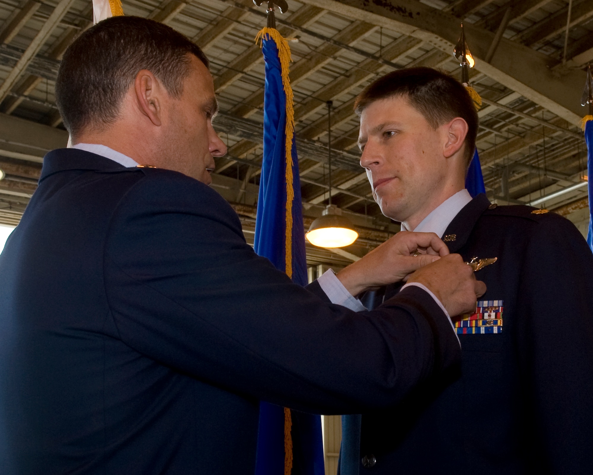 U.S. Air Force Brig. Gen. Matt Molloy, 18th Wing commander, awards Maj. Philip Bryant, 33rd Rescue Squadron, HH-60 Pave Hawk helicopter pilot, the Distinguished Flying Cross on Kadena Air Base, Japan, May 8, 2012. The high honor was awarded to Bryant for his heroic actions during a combat rescue mission in Afghanistan, March 29, 2011. His quick reaction and precision flying saved the lives of himself and the rest of his crew. (U.S. Air Force photo/Staff Sgt. Laszlo Babocsi)