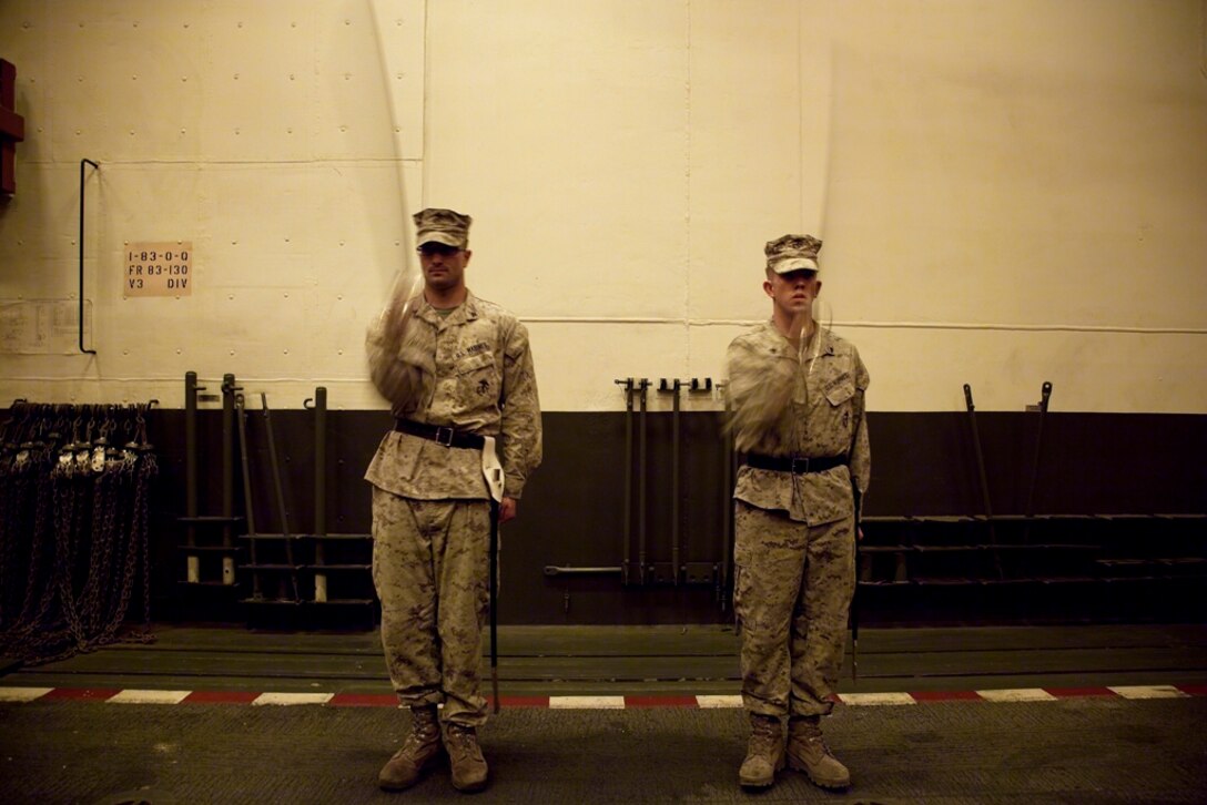 Cpls. Joshua W. Frederick, left, and Gavin S. Reed practice drill movements during formal noncommissioned officer leadership training aboard USS Makin Island here May 9. Frederick, a 24-year-old Mossbluff, La., native, serves as a forward observer with the 11th Marine Expeditionary Unit’s command element. Reed, a 24-year-old Zemple, Minn., native, serves as a supply administrative clerk with Battalion Landing Team 3/1, the ground combat element for the unit. The unit embarked the amphibious assault ship, as well as USS New Orleans and USS Pearl Harbor in San Diego Nov. 14, beginning a seven-month deployment to the Western Pacific, Horn of Africa and Middle East regions.