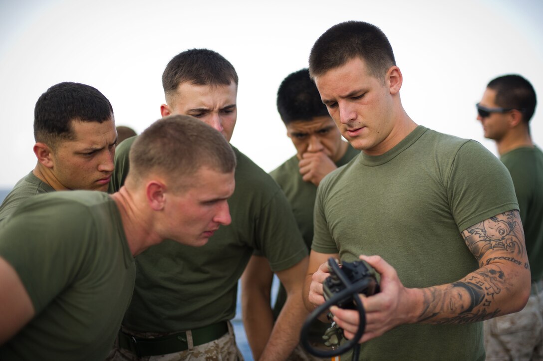 Cpl. Blake Dudek teaches a class on radios during training aboard USS Pearl Harbor here May 9. The Chicago native serves as a radio operator for Combat Logistics Battalion 11, which provides logistics and services for the 11th Marine Expeditionary Unit. The unit embarked the ship, as well as USS Makin Island and USS New Orleans in San Diego Nov. 14, beginning a seven-month deployment to the Western Pacific, Horn of Africa and Middle East regions.