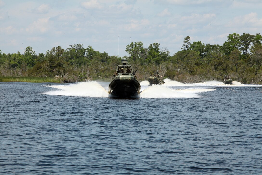 U.S Marines from Security Cooperation Task Force (SCTF) Africa Partnership Station 12 (APS-12), ground combat element, conducts a extraction training with members of the  U.S. Navy Riveron 3 , on May 10, 2012 aboard Camp Lejeune, N.C. This train was designed to familiarize the Marines of APS-12 with specialized tactics that may be used in their upcoming deployment to  Africa.(U.S. Marine Corps photo by Staff Sgt. Jemssy Alvarez Jr.)