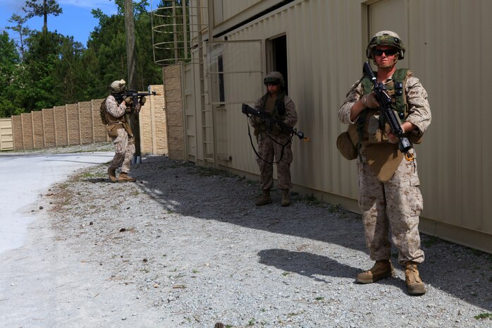Marines with Bridge Company, 8th Engineer Support Battalion, 2nd Marine Logistics Group provide security during a training exercise at a Military Operations in Urban Terrain site aboard Camp Lejeune, N.C., May 9, 2012.  The company spent three days learning patrolling procedures, clearing techniques and communication skills for combat operations.  (U.S. Marine Corps photo by Cpl. Katherine M. Solano)