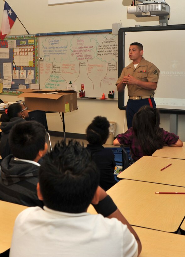 Cpl. Rolando Noriega, a correspondence clerk with Headquarters, 8th Marine Corps District, talked to students at John T. White Elementary School about his life as a U.S. Marine during the school’s first career day May 10, 2012, in Fort Worth, Texas. Noriega also spoke to students from various grades about the importance of a good education and showed a short video on Marine basic training. “It’s important for the Marines to be present at the events,” said Noriega. “This event gives them positive role models and gives them an option to pursue a better life for themselves.”