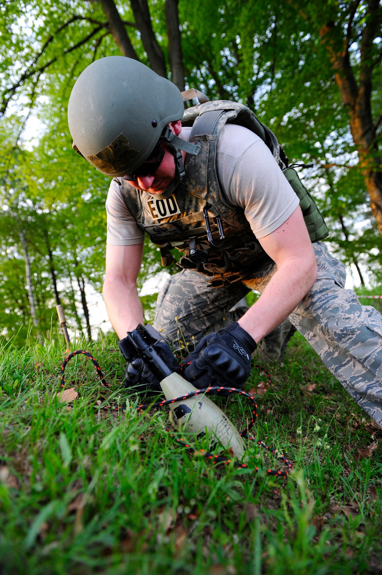 Senior Airman Jeff Gilmer, 786th Civil engineer Squadron, explosive ordinance disposal technician, performs standard procedures on a simulated unexploded ordinance during an operational readiness exercise scenario on Ramstein Air Base, Germany, May 10, 2012. The ORE incorporates a series of scenarios used to evaluate a base's readiness to execute operational duties while responding to various crises. (U.S. Air Force photo/Senior Airman Aaron-Forrest Wainwright)