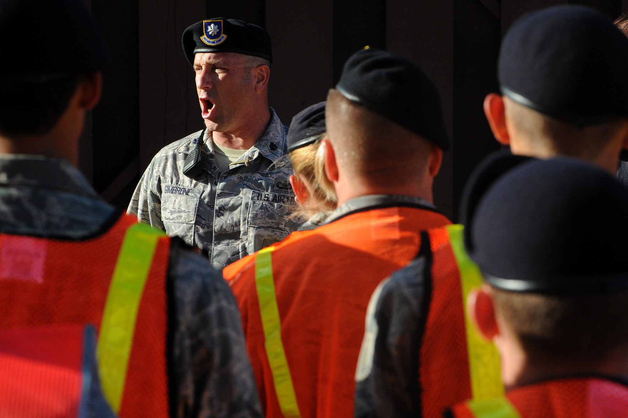 Lt. Col. Michael Gimbrone, 647th Security Forces Squadron commander, speaks to more than 120 volunteers at the beginning of Operation ENLIGHTEN II, May 9, where Airmen and Sailors went to more than 2,000 homes to hand out information about safety and security. In response to a rash of crimes ranging from petty theft to grand larceny, Joint Base Pearl Harbor-Hickam officials engaged residents in the anti-crime campaign. (U.S. Air Force photo/Staff Sgt. Mike Meares)