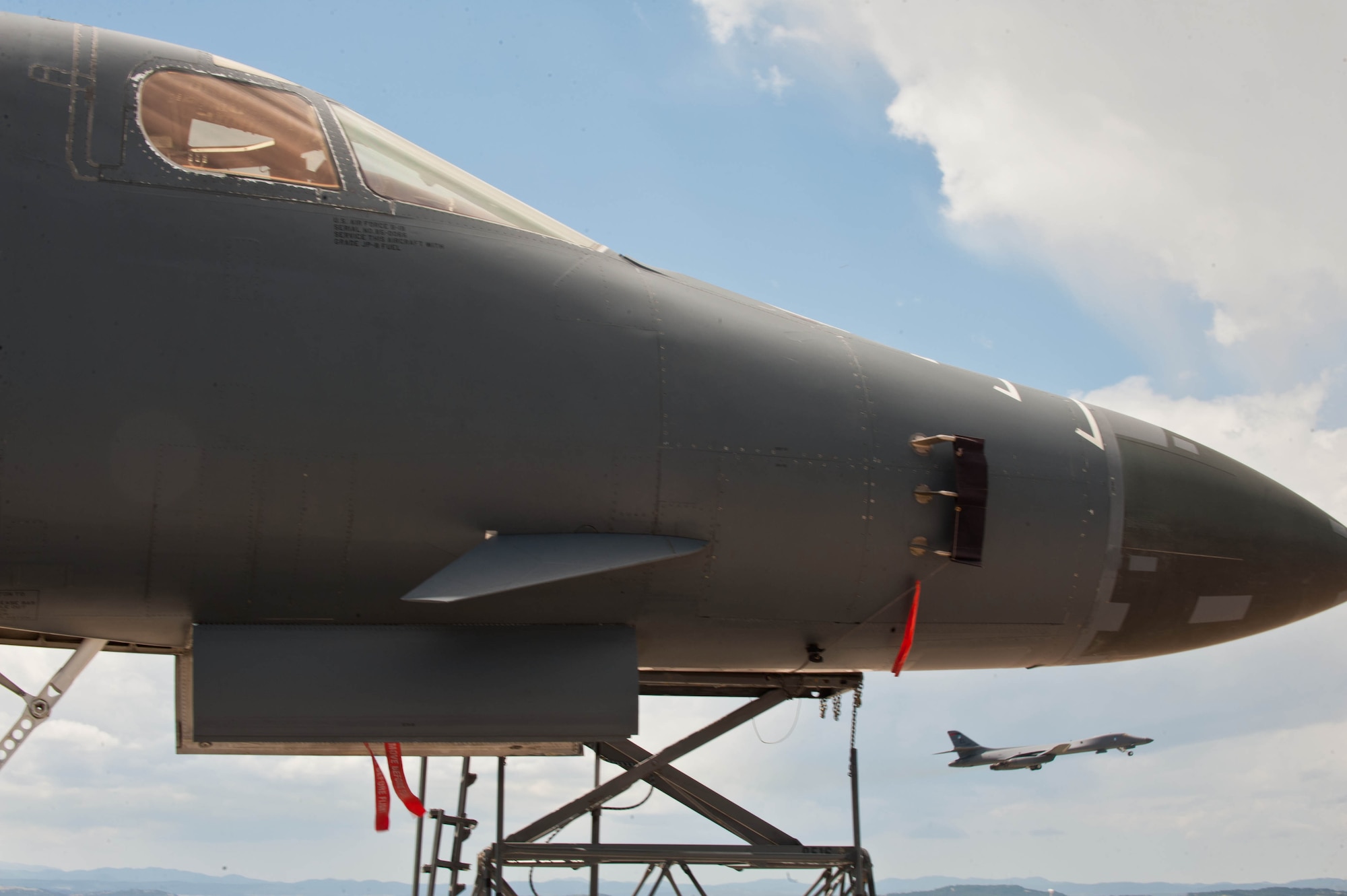Maintenance professionals from the 28th Maintenance Group tow a B-1 back to the aircraft parking area following a training mission at Ellsworth Air Force Base, S.D., May 4, 2012. The B-1 was first used in combat support operations during Operation Desert Fox in December of 1998. (U.S. Air Force photo by Airman 1st Class Zachary Hada/Released)