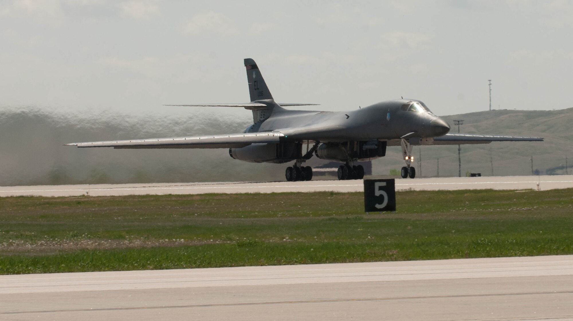 A B-1 roars down the base runway prior to a training mission at Ellsworth Air Force Base, S.D., May 4, 2012. The B-1 can handle a weapons load of 75,000 pounds and can fly 4,600 miles without refueling. (U.S. Air Force photo by Airman 1st Class Zachary Hada/Released)