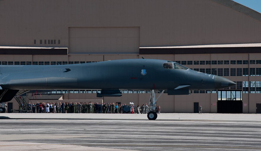 Airmen and invited guests of surrounding communities gather on the flightline near the the Pride Hangar at the conclusion of the 37th Bomb Squadron Change of Command at Ellsworth Air Force Base, S.D., May 4, 2012.  Lt Col. Stuart Newberry, took command of the 37th BS “Tigers”. The event culminated with a B-1 Warrior Flyby. (U.S. Air Force photo by Airman 1st Class Zachary Hada/Released)