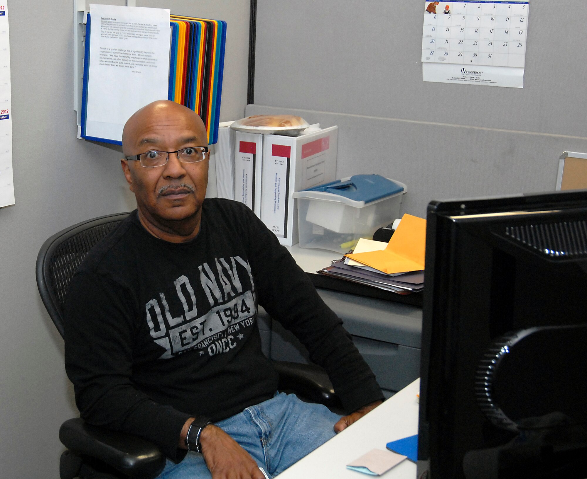 Charles Ivory, 95th Communications Squadron program analyst and acquisition project specialist, sits at his desk on his final day at Edwards Air Force Base before flying out to Fort Dix, N.J., May 7.  A Vietnam veteran, Ivory, 66, will undergo final pre-deployment training before heading to Afghanistan to serve as a contract specialist for the U.S. Army Corps of Engineers.  He volunteered through the Civilian Expeditionary Workforce Program. (U.S. Air Force photo by Kenji Thuloweit)