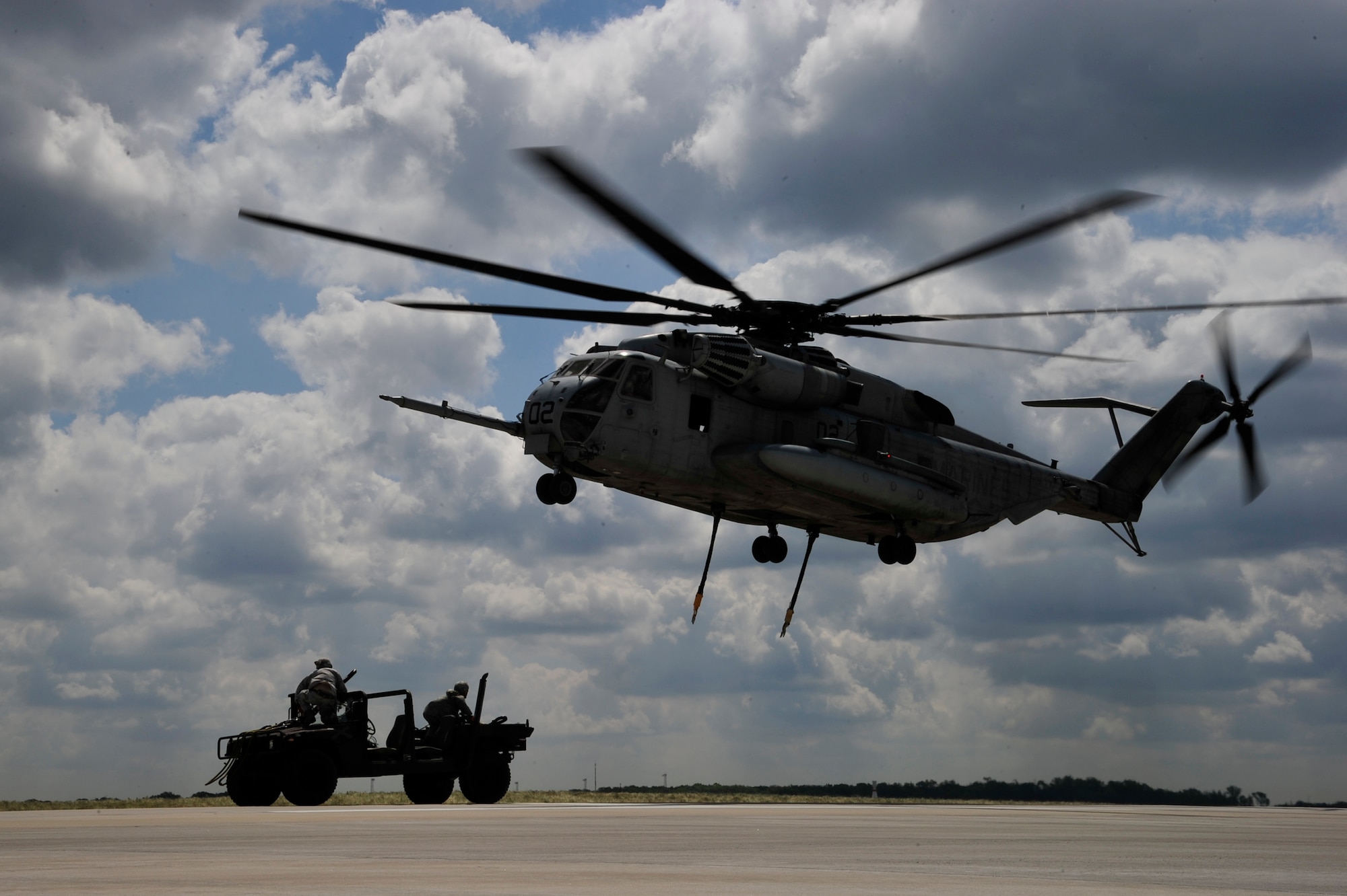 A U.S. Marine Corps CH-53E Super Stallion from Marine Heavy Helicopter Squadron 772 conducts slingload operations with Airmen from the 621st Contingency Response Wing at Joint Base McGuire-Dix-Lakehurst, N.J., May 10. Both units were preparing for a Marine airpower demonstration at the 2012 JB MDL Open House and & Air Show, scheduled for May 12 and 13.  (U.S. Air Force photo by Tech. Sgt. Parker Gyokeres)