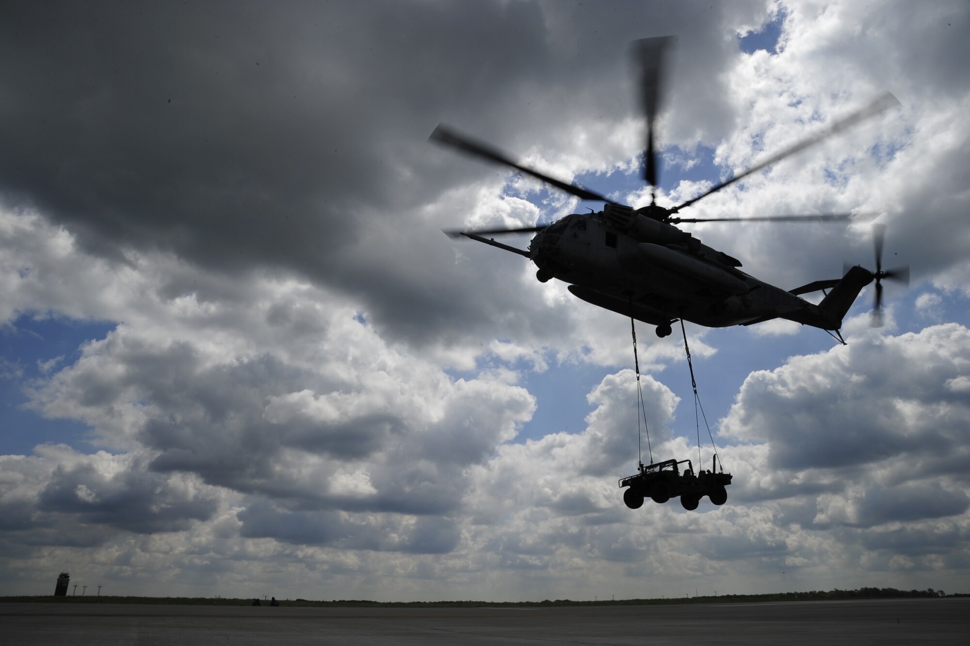 A U.S. Marine Corps CH-53E Super Stallion from Marine Heavy Helicopter Squadron 772 conducts slingload operations with Airmen from the 621st Contingency Response Wing at Joint Base McGuire-Dix-Lakehurst, N.J., May 10. Both units were preparing for a Marine airpower demonstration at the 2012 JB MDL Open House and & Air Show, scheduled for May 12 and 13.  (U.S. Air Force photo by Tech. Sgt. Parker Gyokeres)