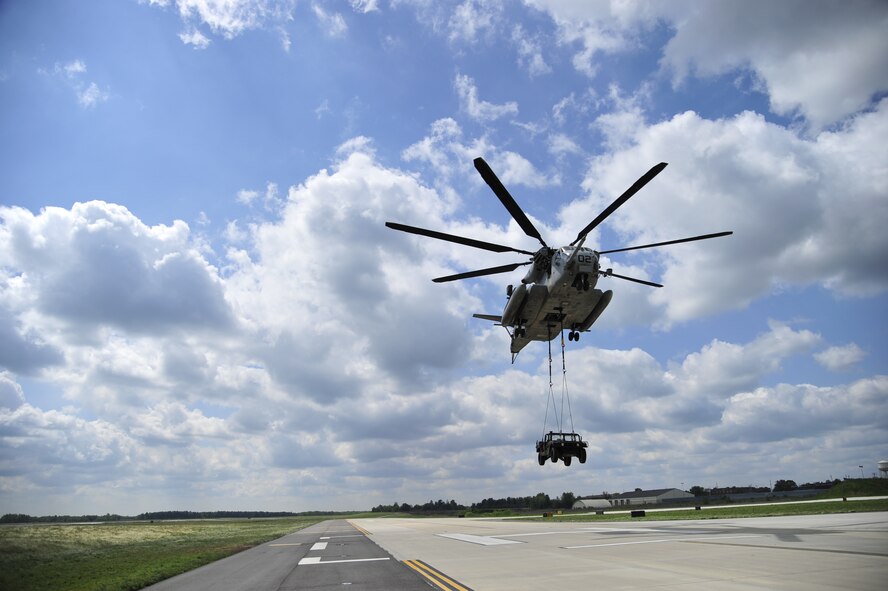 A U.S. Marine Corps CH-53E Super Stallion from Marine Heavy Helicopter Squadron 772 conducts slingload operations with Airmen from the 621st Contingency Response Wing at Joint Base McGuire-Dix-Lakehurst, N.J., May 10, 2012. Both units were preparing for a Marine airpower demonstration at the 2012 JB MDL Open House and Air Show, scheduled for May 12 and 13, 2012. (U.S. Air Force photo/Tech. Sgt. Parker Gyokeres)