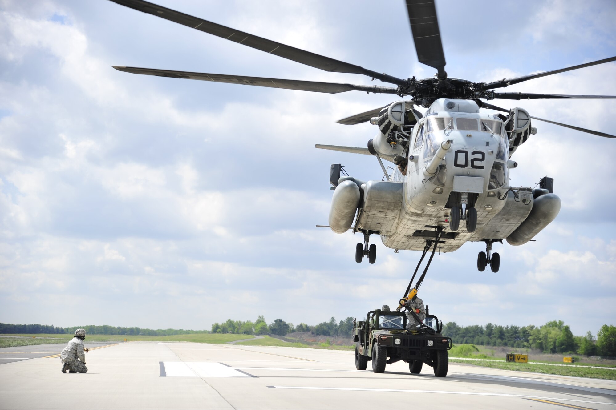 A U.S. Marine Corps CH-53E Super Stallion from Marine Heavy Helicopter Squadron 772 conducts slingload operations with Airmen from the 621st Contingency Response Wing at Joint Base McGuire-Dix-Lakehurst, N.J., May 10. Both units were preparing for the Marine airpower demonstration at the 2012 JB MDL Open House and & Air Show, scheduled for May 12 and 13.  (U.S. Air Force photo by Tech. Sgt. Parker Gyokeres)