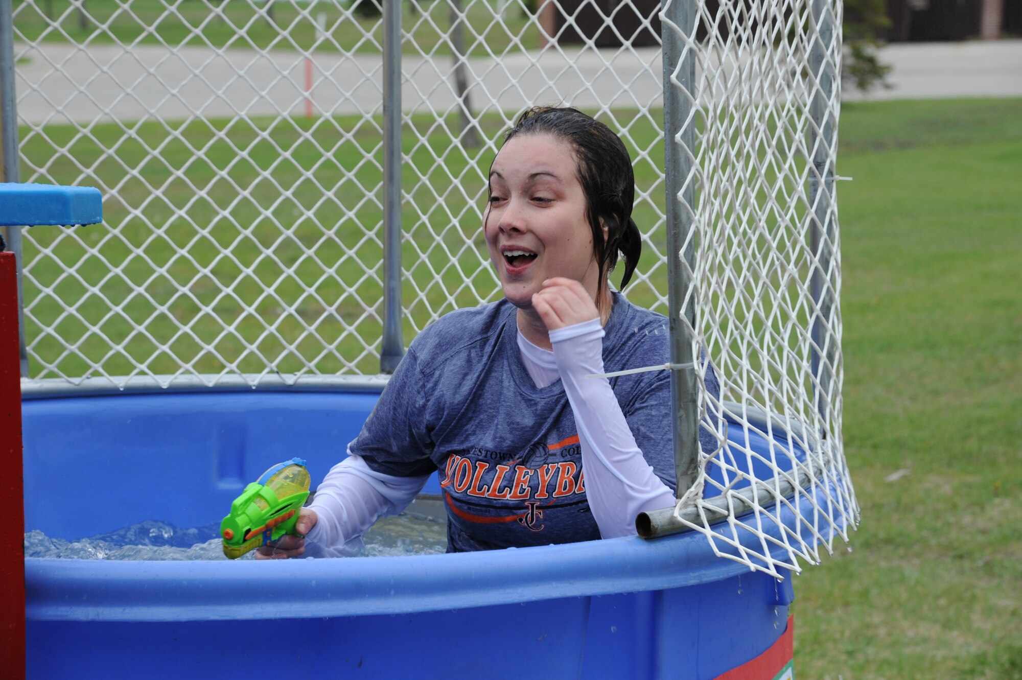 Resident teacher Tenneil Juntunen smiles after going under the water in the dunk tank during the School Carnival on May 8, 2012, on Grand Forks Air Force Base, N.D.