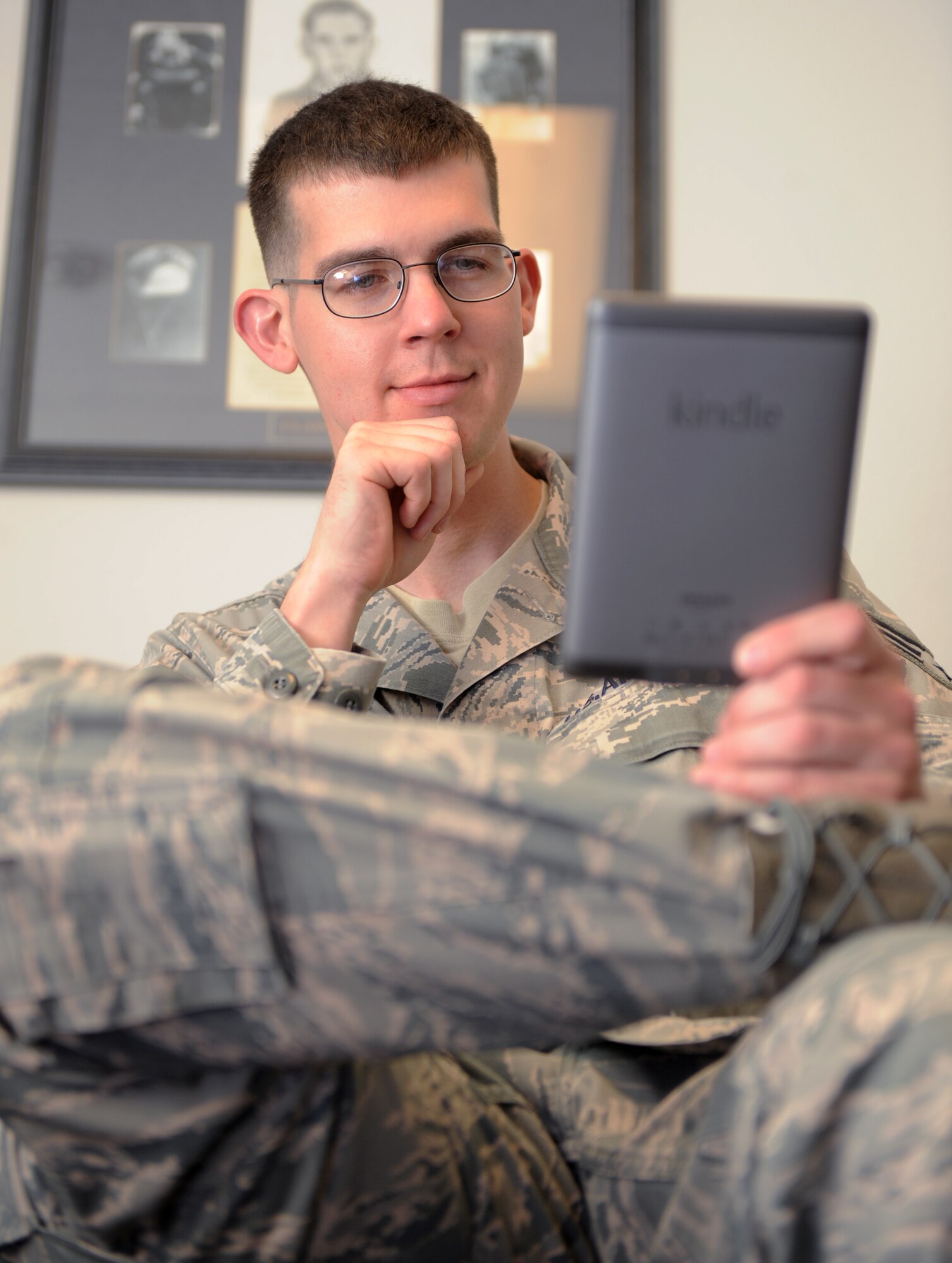 U.S. Air Force Senior Airman Eric Housend, 366th Operations Support Squadron, studies on a popular e-book during a break from class at the Airman Leadership School on Mountain Home Air Force Base, Idaho, May 10, 2012. Prior to Class 12-E receiving the e-books, the school had to print four volumes of lessons for each student. The e-books have helped the school not only cut costs, but also to be environmentally friendly. (U.S. Air Force photo/Airman 1st Class Jonathan Glanville)