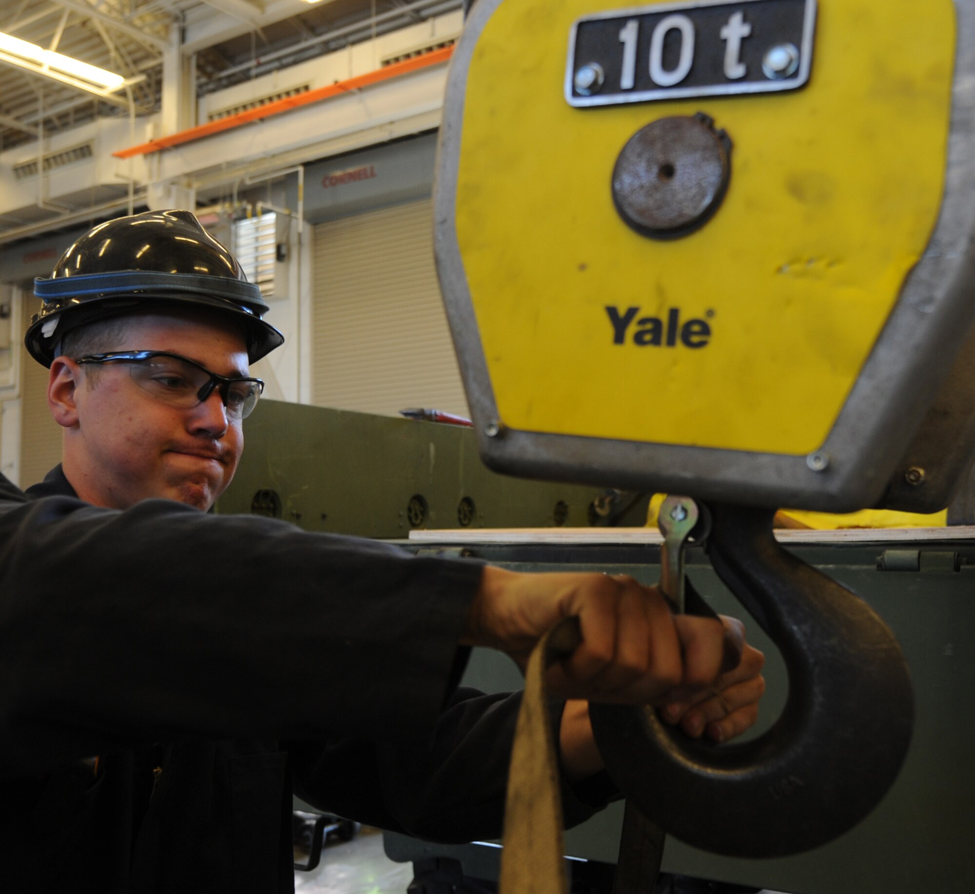 U.S. Air Force Airman 1st Class Jordan Arndt, 726th Air Control Squadron vehicle maintainer, ensures a bin of tools and vehicle parts is properly secured to an overhead crane during an exercise at Mountain Home Air Force Base, Idaho, May 10, 2012.  The squadron has more than 20 different Air Force Specialty Codes and is designed to deploy at a moment’s notice. (U.S. Air Force photo/Staff Sgt. Gina Paige)