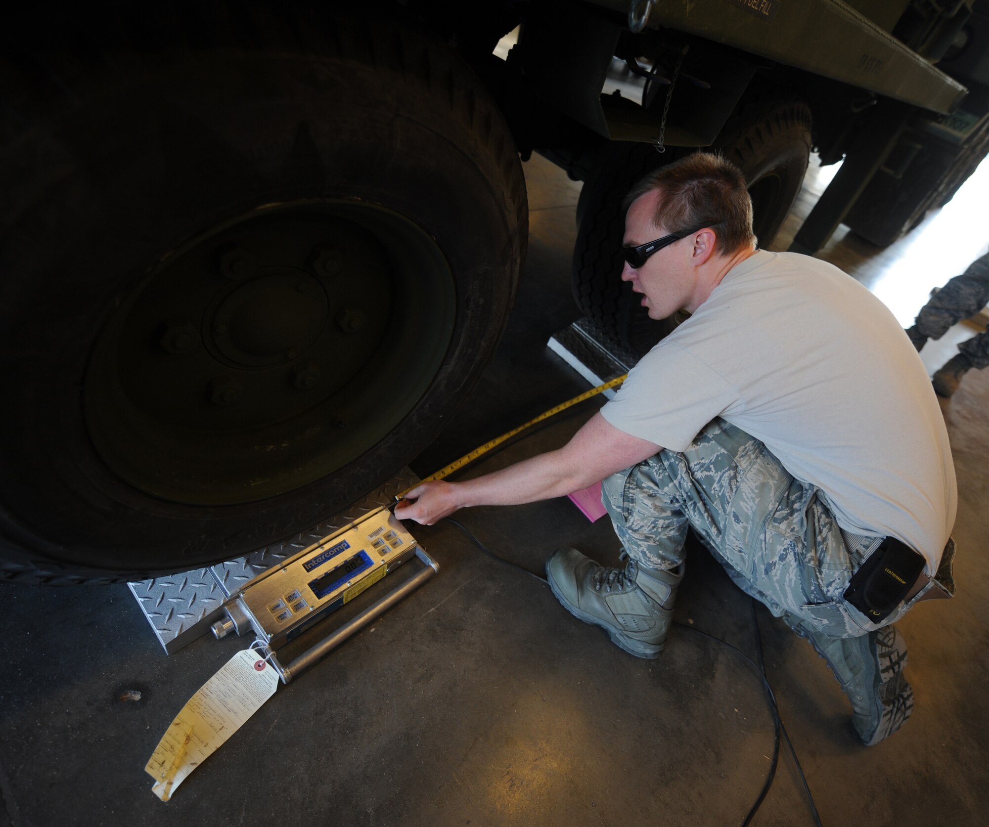 U.S. Air Force Senior Airman Lindell Walley, 726th Air Control Squadron aircraft structural maintenance, gathers measurements for a new ramp at Mountain Home Air Force Base, Idaho, May 10, 2012.  The unit is preparing to build a weighing ramp, which will help reduce man hours and ensure a faster, but accurate process. (U.S. Air Force photo/Staff Sgt. Gina Paige)