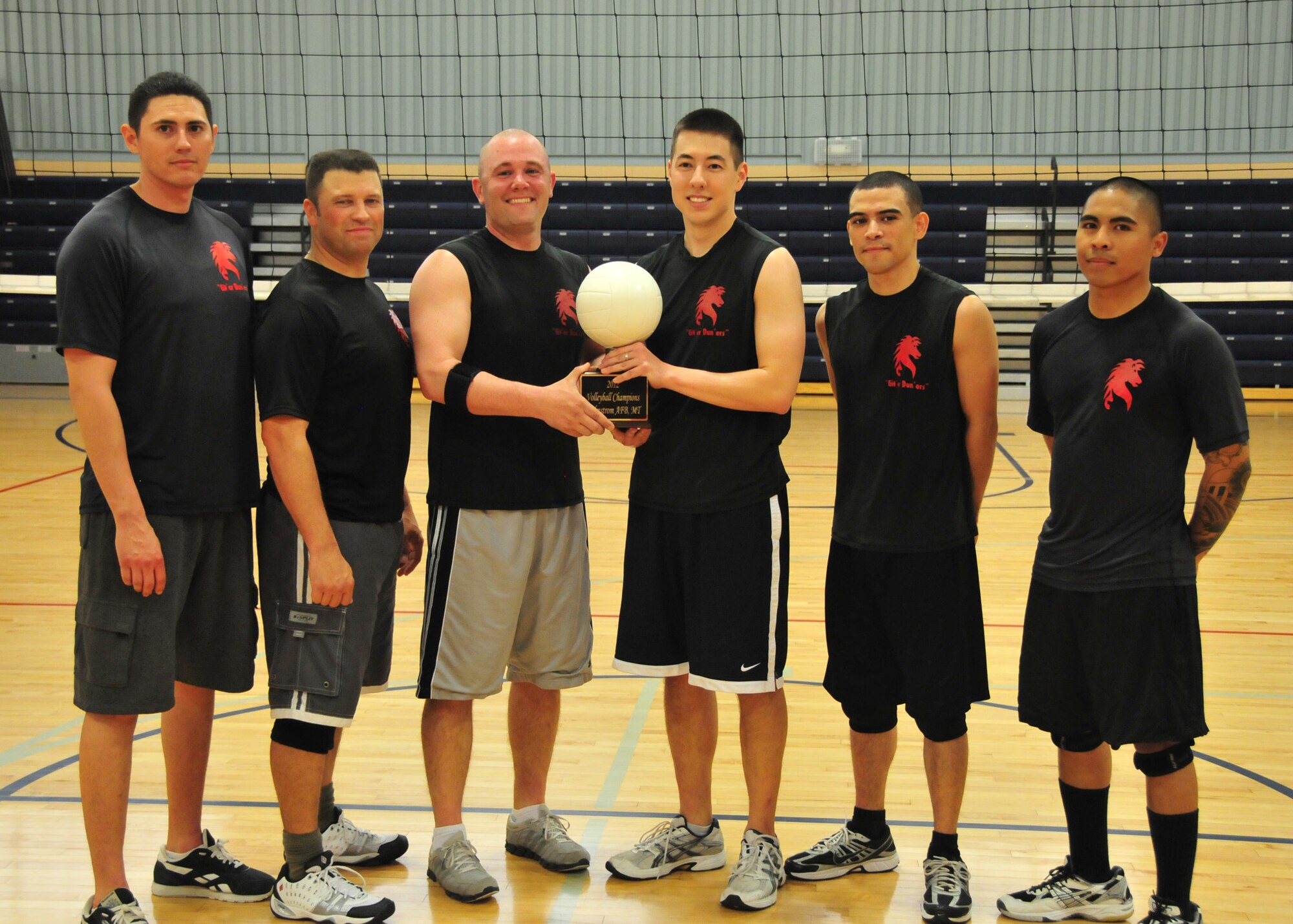 Members of the 819th RED HORSE Squadron intramural volleyball team pose with their first-place trophy following the intramural championship game May 2. Players from left to right are, Staff Sgt. Emmanual Martinez, Master Sgt. Robert Jenkins, Staff Sgt. Justin Watson, Capt. Nick Saccone, Airman 1st Class Cecilio Fantauzzimendoza and Staff Sgt. Antonio Ecevedo. Players not pictured are Col. Mark Zimmerhanzel, Master Sgt. Shannon Calcote, and Tech. Sgts. Elizabeth Ayala and Rhonda Bargas. (U.S. Air Force courtesy photo)