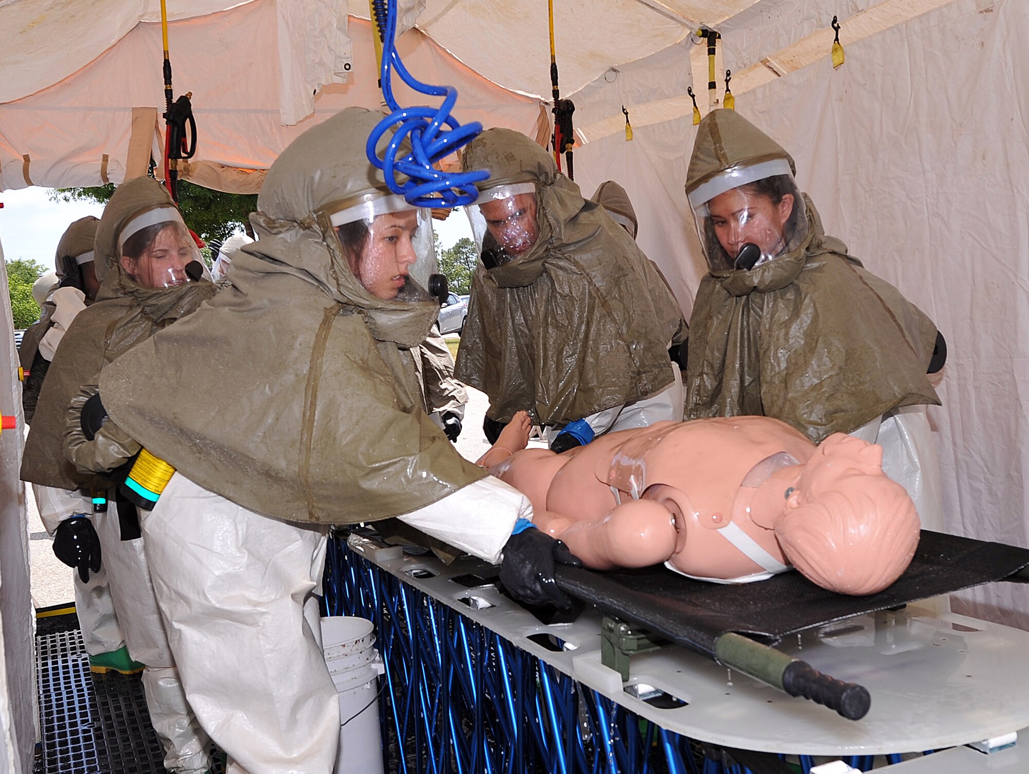 Airmen from the 78th Medical Group decontaminate a simulated victim during the In-Place Patient Decontamination Exercise.(U. S. Air Force photo by Tommie Horton)