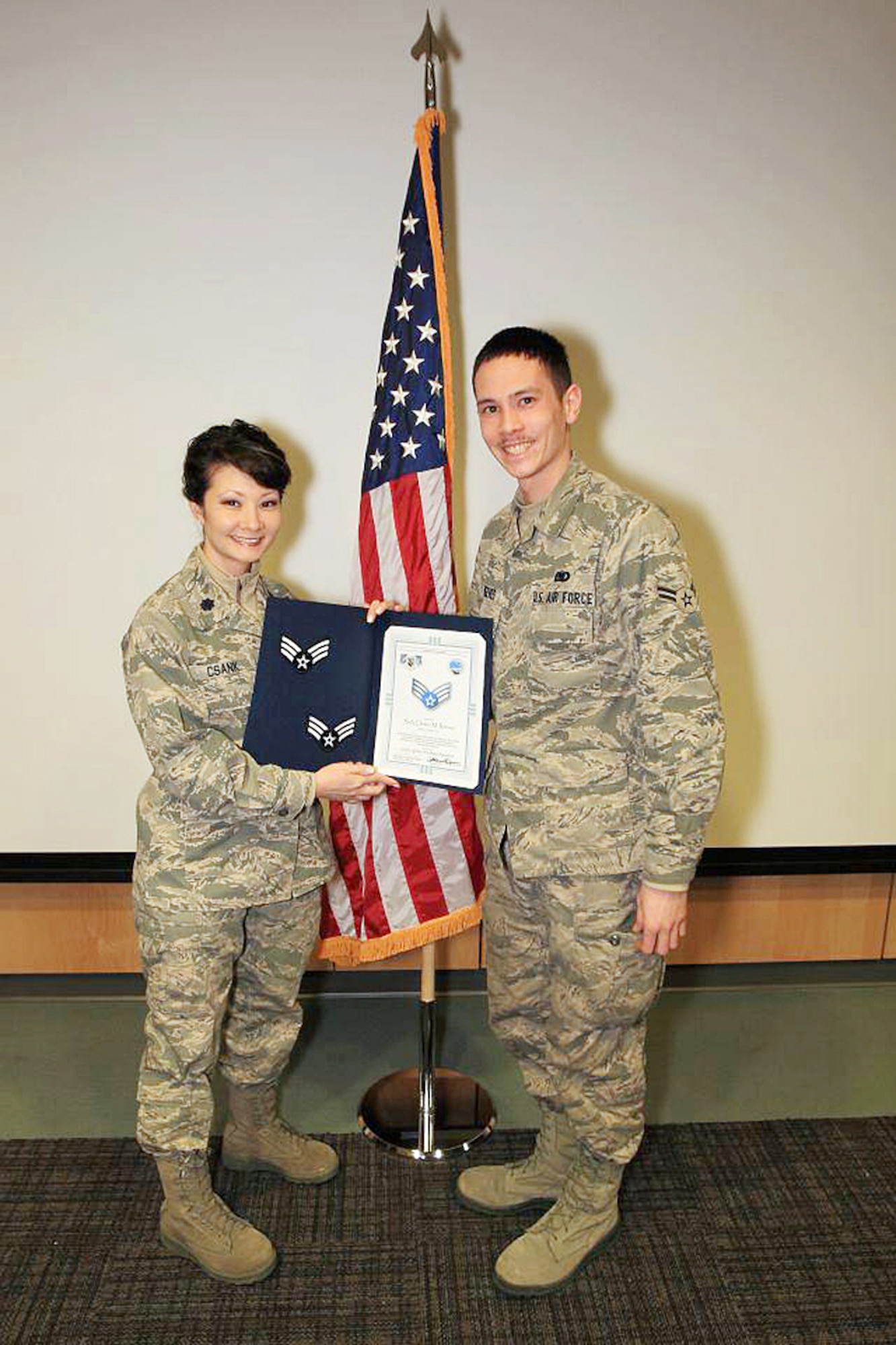 Senior Airman Clinton Reeves, a fuel specialist with the 673d Logistics Readiness Squadron, receives his certificate of promotion from squadron commander Lt. Col. Patricia Csank on Joint Base Elmendorf-Richardson, Alaska, recently. Reeves' body was found May 8 after he had been missing since April 19. Another Airman has been charged with six counts of tampering with evidence.
(Courtesy photo)
