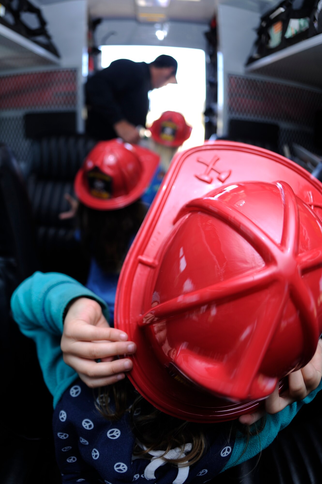 VANDENBERG AIR FORCE BASE, Calif. -- Space and Sea Girl Scouts learn about the instruments and tools inside the Vandenberg Hot Shot truck during a safety awareness class at the parade grounds here Wednesday, May 9, 2012. The Vandenberg Hot Shots explained their role in fighting wilderness fires and showed the tools they use to fight fire. (U.S. Air Force photo/Staff Sgt. Andrew Satran) 

 