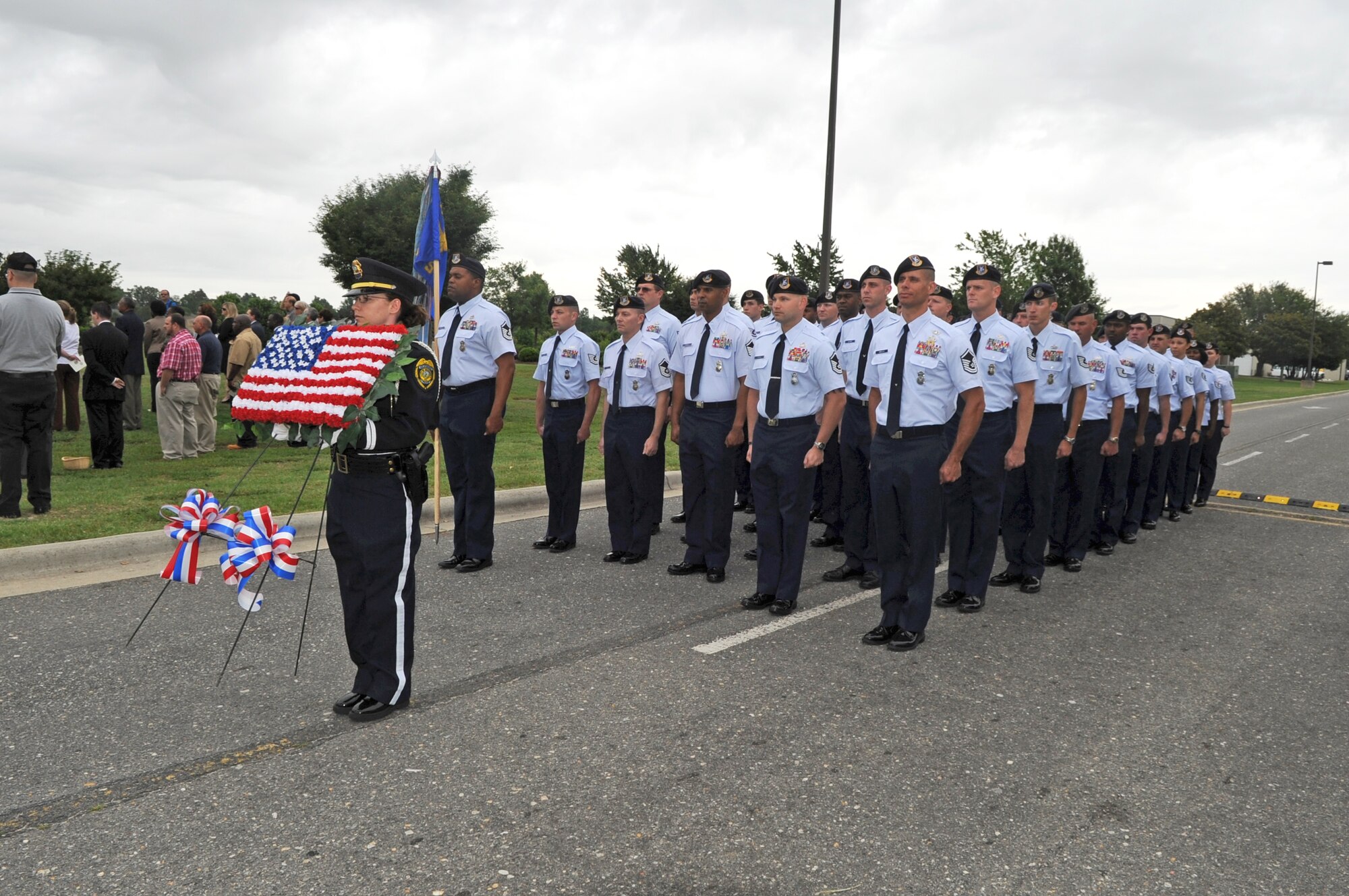U.S. Air Force Airmen from the 4th Security Forces Squadron stand in formation during a memorial service to kick-off National Police Week at Wayne Community College in Goldsboro, N.C., May 9, 2012. The memorial service honored police officers who have sacrificed their lives in the line of duty. (U.S. Air Force photo/Senior Airman Gino Reyes/Released)