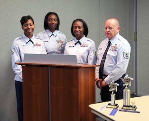 The four Airmen from the Air Reserve Personnel Center who are participating in the Defenders of Speech team at Buckley Air Force Base: Staff Sgt. Letitia Edwards ARPC loan repayment and stipend program NCO in charge; Staff Sgt. Zakia Walker, ARPC personnel systems manager; Staff Sgt. Jennifer Williams, ARPC officer accessions NCO in charge, and Tech. Sgt. Richard Grybos, ARPC Defense Enrollment Eligibility Reporting System project office technician, pose for a photo May 10, 2012, on Buckley Air Force Base, Colo. (U.S. Air Force photo/Quinn Jacobson)