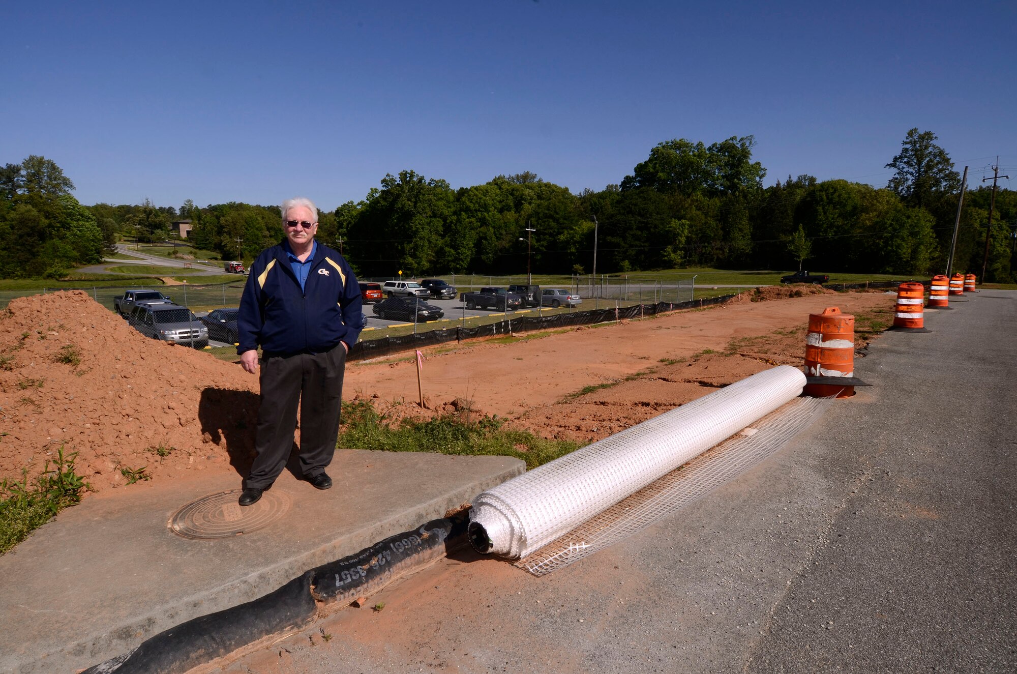 Hugh Phillips, 94th Civil Engineer Squadron, stands by the Security Forces building parking lot expansion project at Dobbins Air Reserve Base, Apr. 12.  This is one of many projects in various stages of progress which the base civil engineers initiate and monitor through to a successful l completion.  (U.S. Air Force photo/ Brad Fallin)