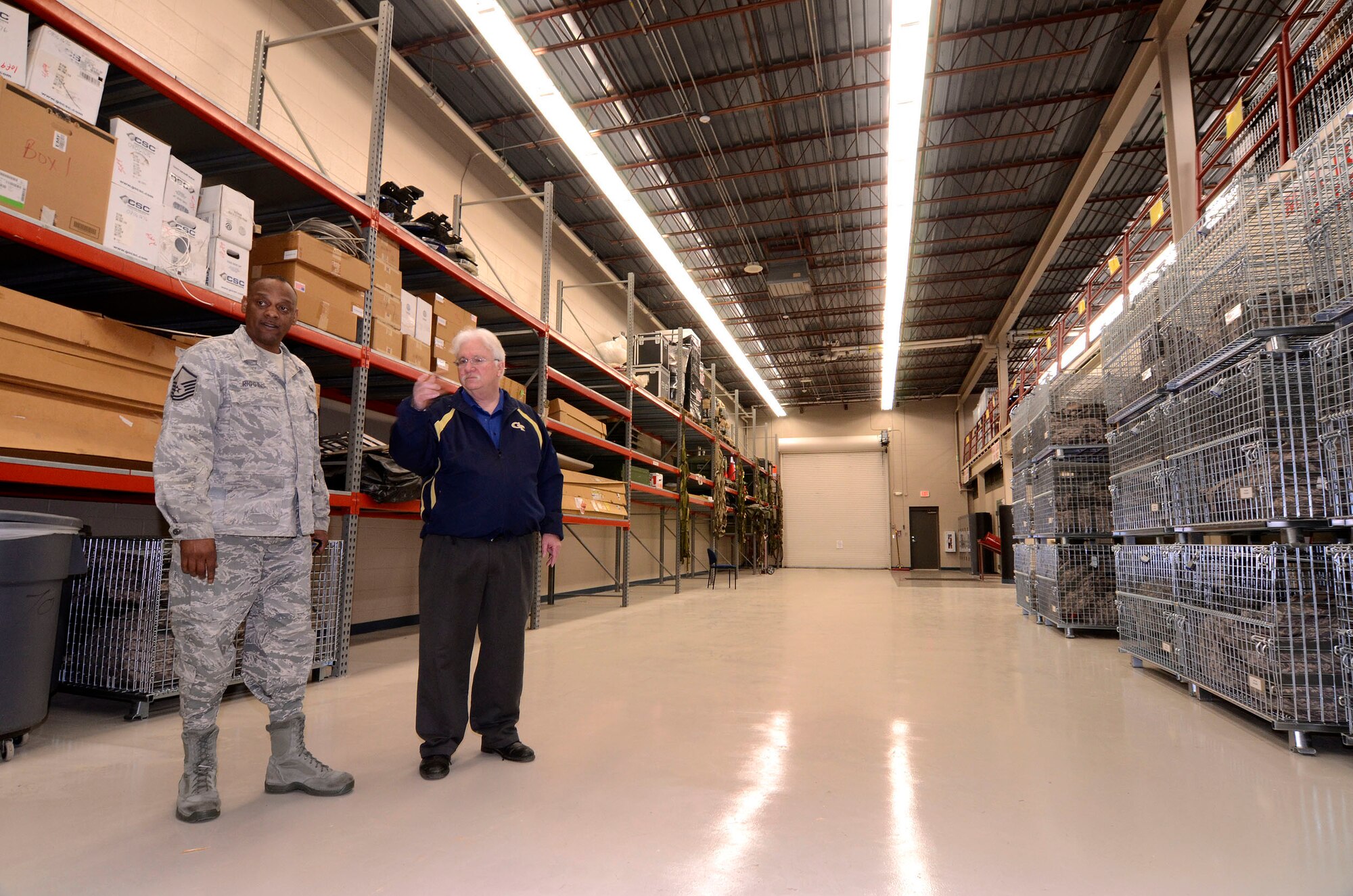 Hugh Phillips, 94th Civil Engineer Squadron, points out some features of the Security Forces storage area remodel to Master Sgt. Dennis Riggins, 94th Security Forces Squadron force protection and antiterrorism officer, at Dobbins Air Reserve Base, Apr. 12.  This is one of many projects in various stages of progress which the base civil engineers initiate and monitor through to a successful l completion.  (U.S. Air Force photo/ Brad Fallin)