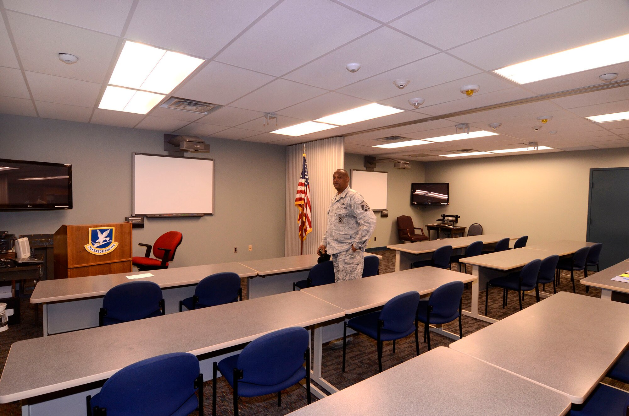 Master Sgt. Dennis Riggins, 94th Security Forces Squadron, looks at new, energy saving lighting features of the remodeled conference/training room in the Security Forces building at Dobbins Air Reserve Base, Apr. 12.  This is one of many projects in various stages of progress which the base civil engineers initiate and monitor through to a successful l completion.  (U.S. Air Force photo/ Brad Fallin)