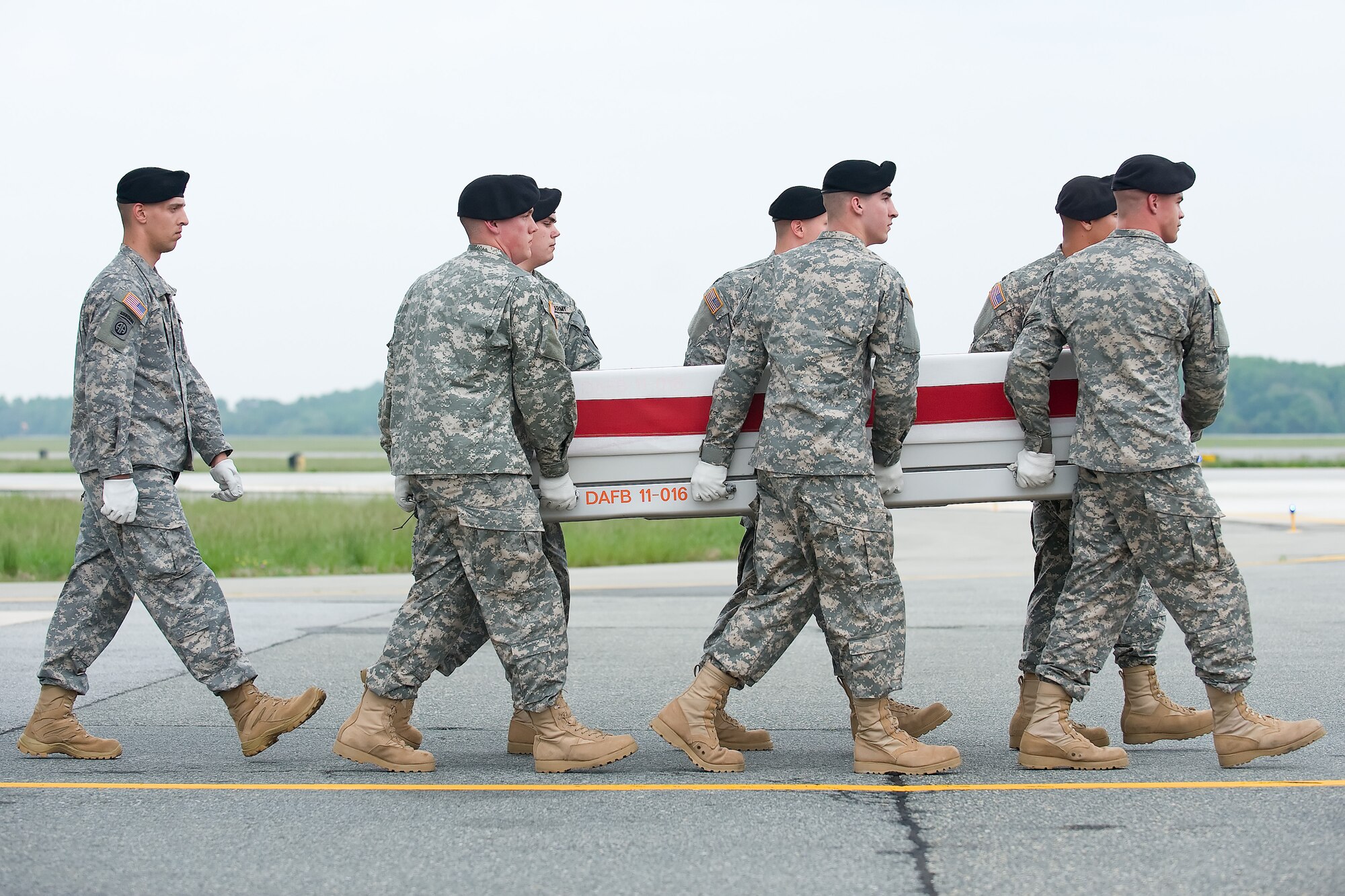 A U.S. Army carry team transfers the remains of Army Pfc. Dustin D. Gross of Jeffersonville, Ky., at Dover Air Force Base, Del., May 9, 2012. Gross was assigned to the 3rd Squadron, 73rd Cavalry Regiment, 1st Brigade Combat Team, 82nd Airborne Division, Fort Bragg, N.C. (U.S. Air Force photo/Adrian R. Rowan)