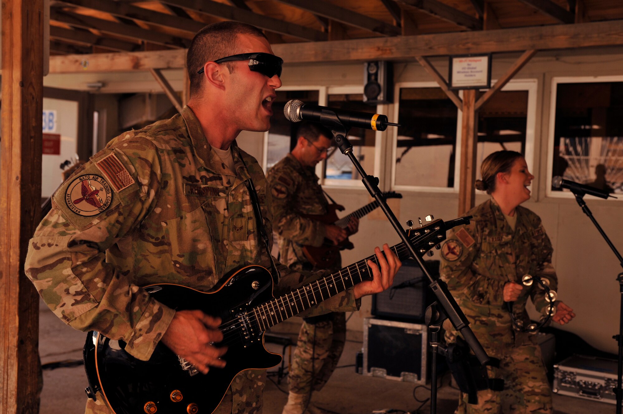 Members of the Air Forces Central band Night Wing perform in front of the Exchange at Bagram Airfield, Afghanistan, May 9, 2012. Bagram was one of the last places Night Wing visited during their deployment, which took them through seven different countries throughout Southeast Asia. (U.S. Air Force photo/Airman 1st Class Ericka Engblom)