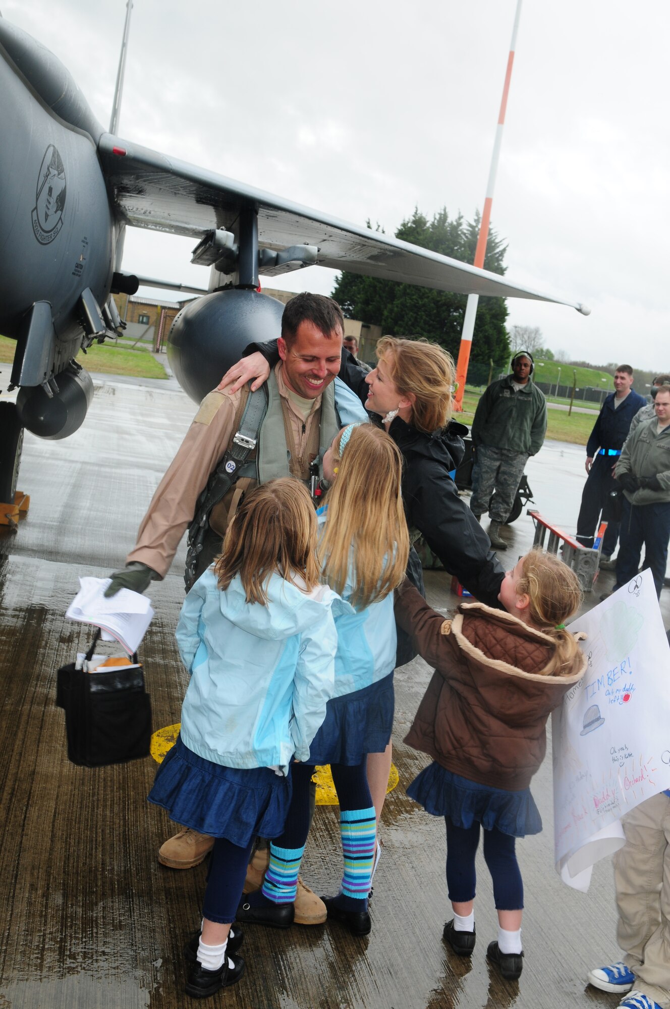 ROYAL AIR FORCE LAKENHEATH, England – Lt. Col. John Orchard, 492nd Fighter Squadron commander, hugs his family after returning from deployment May 9, 2012. Families, as well as other members from the 48th Fighter Wing, welcomed the squadron home after a six month deployment.  (U.S. Air Force photo by Airman 1st Class Cory D. Payne)