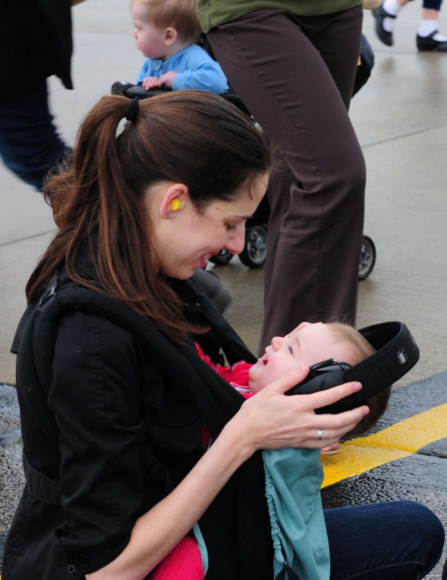 ROYAL AIR FORCE LAKENHEATH, England ? Amanda Deflorio smiles with her 9-month-old daughter Emmaline as she waits for her husband?s return from deployment, May 9, 2012.  Families, as well as other members from the 48th Fighter Wing, welcomed the squadron home after a six month deployment.  (U.S. Air Force Photo by 2nd Lt. Lyndsey Horn)