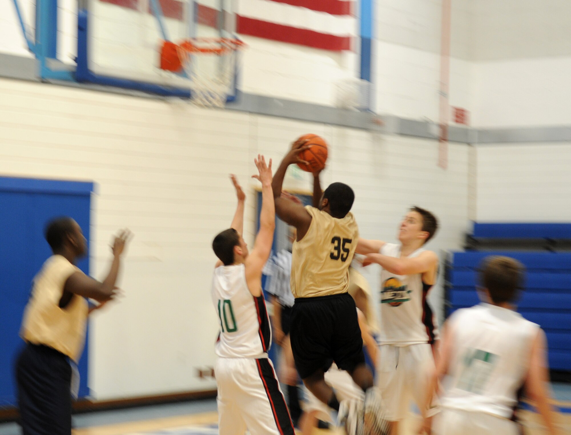 RAF MILDENHALL, England – Eighth grader Trevaun Walker, RAF Mildenhall and RAF Lakenheath combined youth seventh and eighth grade basketball team, goes up for a layup during a game against a Lynn Nets basketball club’s under 16 team May 5, 2012, at the Lakenheath Fitness Center. The Nets won the first game 55 to 58, and the American youth won the second game 56 to 55. (U.S. Air Force photo/Staff Sgt. Christopher Waller)