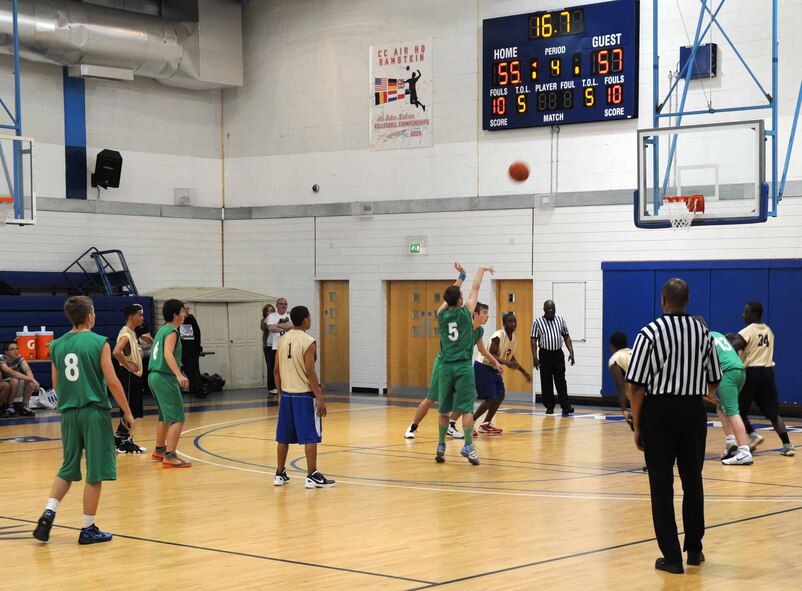 RAF MILDENHALL, England – A player from the Lynn Nets basketball club’s under 16 team makes the final basket in the first game against the RAF Mildenhall and RAF Lakenheath combined youth seventh and eighth grade basketball team May 5, 2012 at the Lakenheath Fitness Center. The Nets won the first game 55 to 58, and the American youth won the second game 56 to 55. (U.S. Air Force photo/Senior Airman Rachel Waller)