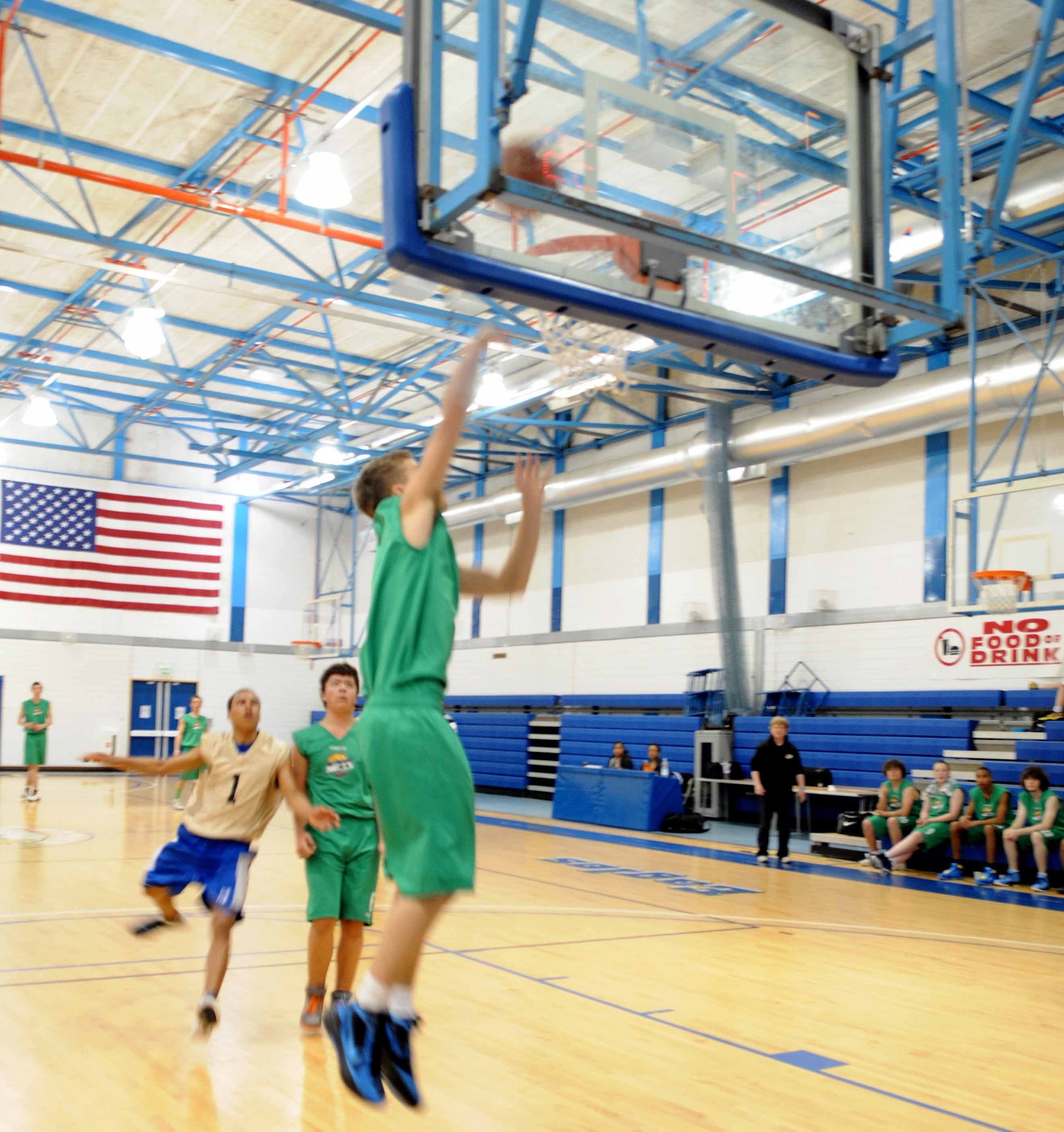 RAF MILDENHALL, England – Tony Murray, a member of Lynn Nets basketball club’s under 16 team, makes a layup after stealing the basketball away from the RAF Mildenhall and RAF Lakenheath combined youth seventh and eighth grade basketball team May 5, 2012 at the Lakenheath Fitness Center. The Nets won the game, 55 to 58. (U.S. Air Force photo/Senior Airman Rachel Waller)