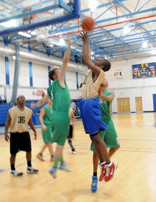 RAF MILDENHALL, England – Jonathan Doss, RAF Mildenhall and RAF Lakenheath combined youth seventh and eighth grade basketball team, makes a layup during a game against a Lynn Nets basketball club’s under 16 team May 5, 2012 at the Lakenheath Fitness Center. The Nets won the first game, 55 to 58, and the American youth won the second game, 56 to 55. (U.S. Air Force photo/Senior Airman Rachel Waller)