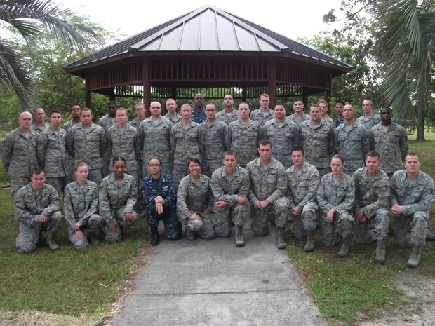 Students from Joint Base Charleston’s Airman Leadership School pose for a class photo. Class 12-D was the first class to graduate Navy Sailors from JB Charleston’s ALS. The Sailors are (third row center) Petty Officer 2nd Class Japheth Tillman, from the Naval Health Clinic Charleston, (third row right) Petty Officer 2nd Class Bradley Nguyen, from the 628th Security Forces Squadron and Petty Officer 2nd Class Crystal Medina, (first row) from the 628th Communications Squadron. (Courtesy photo)