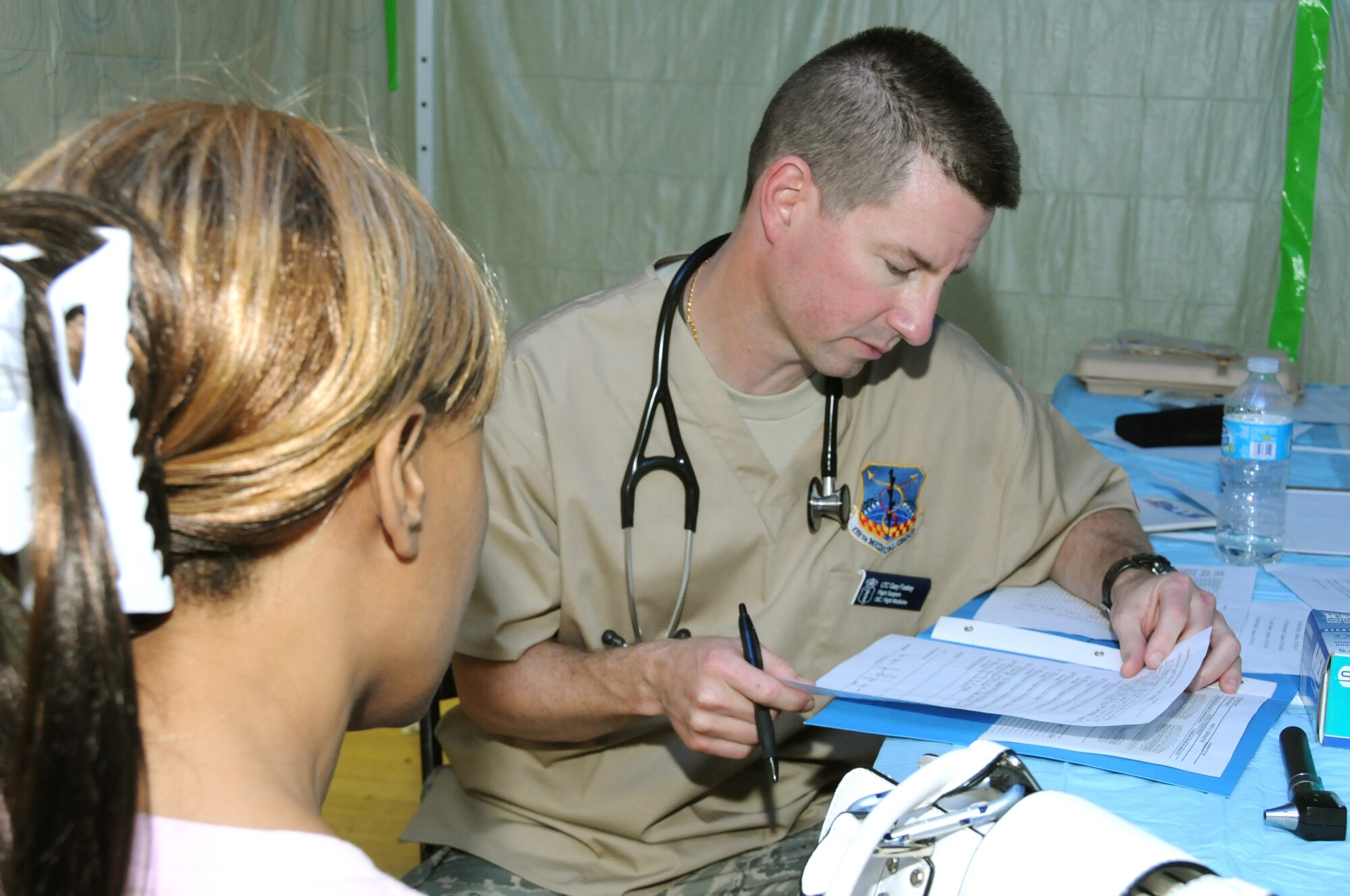 Lt. Col. Gary Foskey,178th Medical Squadron, Ohio Air National Guard, provides a medical screening to a patient at a Demopolis medical clinic in Demopolis, Ala. on May 1, 2012 as part of innovative readiness training mission Alabama Care. IRT Alabama Care 2012 is an Air National Guard led, multiservice mission comprised of active, reserve, and National Guard members from Army, Navy and Air Force components providing service members with readiness training while providing Alabama residents with free health services such as dental, optometry and medical screenings from May 1-10, 2012 in the medically underserved and economically depressed communities of Selma, Demopolis and Hayneville, Ala.