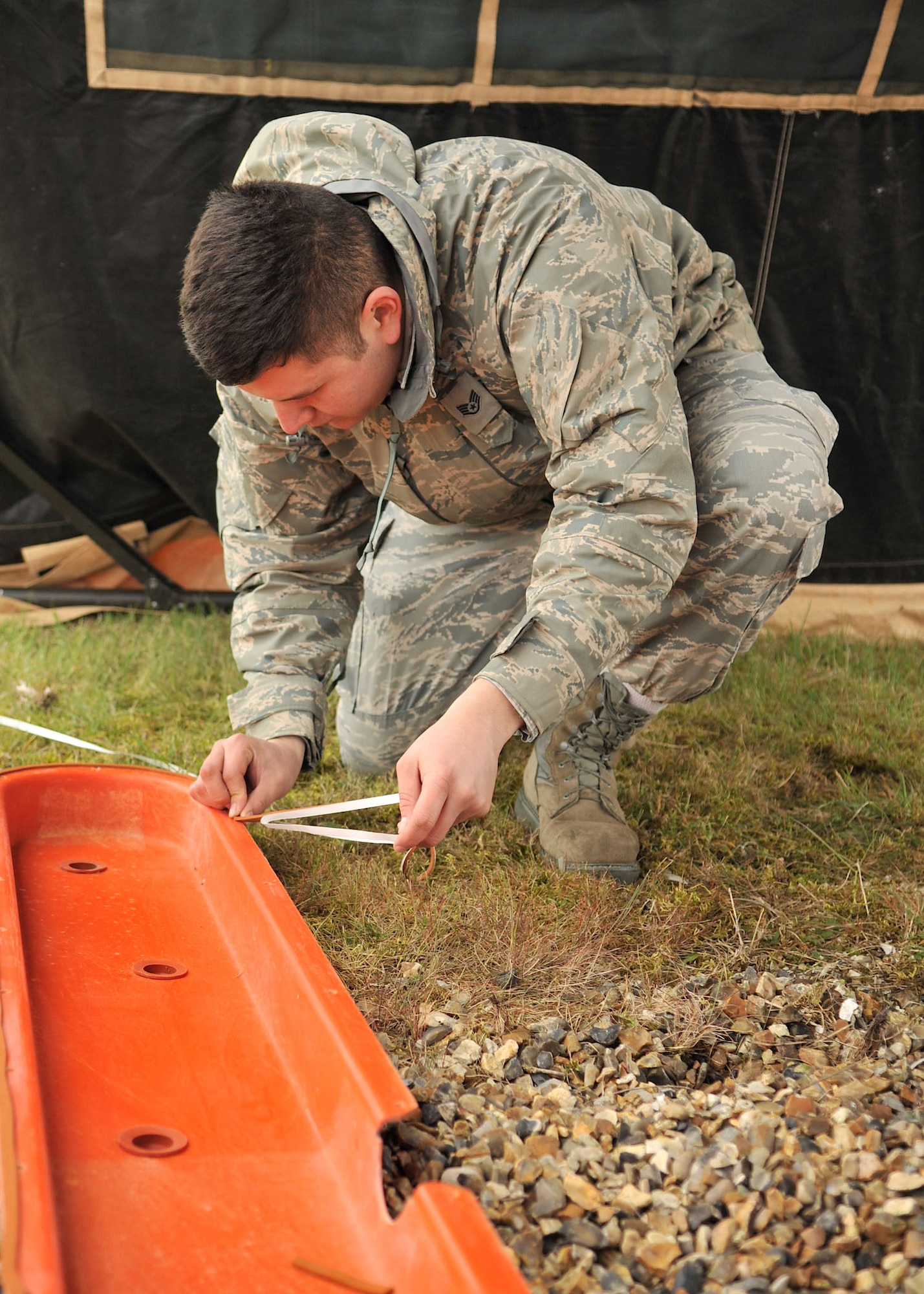 RAF MILDENHALL, England – Staff Sgt. Sergio Santos, 100th Communications Squadron, puts sealant tape on the shell of a localizer antenna here May 4, 2012. Airmen from the 100th CS airfield systems flight perform routine checks on the instrument landing system regularly. (U.S. Air Force photo/Senior Airman Jerilyn Quintanilla)