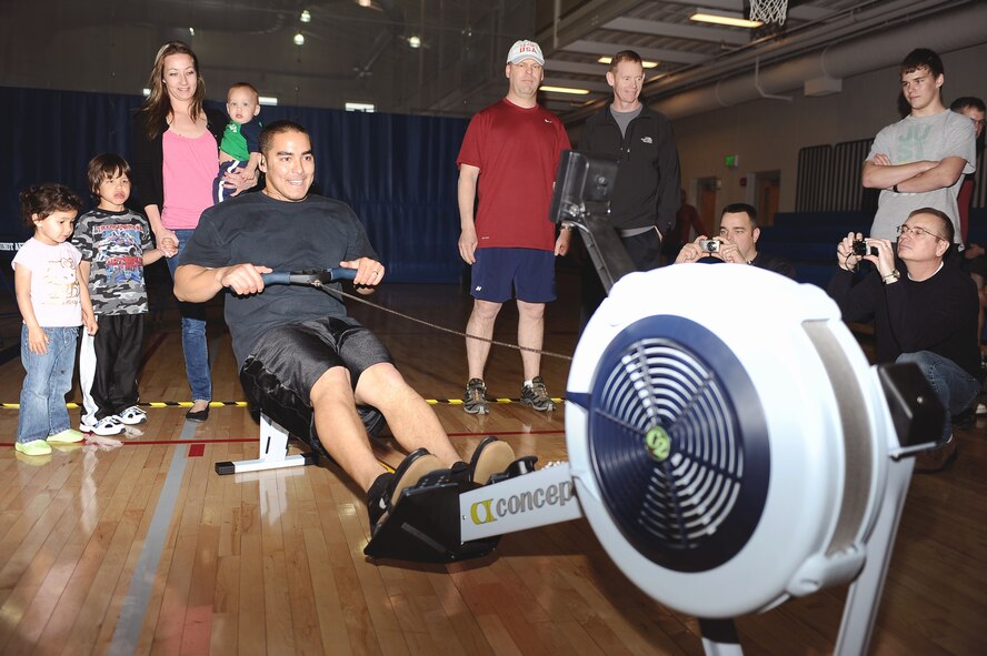 Staff Sgt. Jonathan Every, 5th Aircraft Maintenance Squadron aircraft crew chief, completes his final rowing set for the Air Force Global Strike Command Rowing Challenge at the McAdoo Sports and Fitness Center May 5. Every rowed a total of 1,024,657 meters for the competition, which placed him in third place among top individual rowers in Global Strike Command. (U.S. Air Force photo/Airman 1st Class Kristoffer Kaubisch)