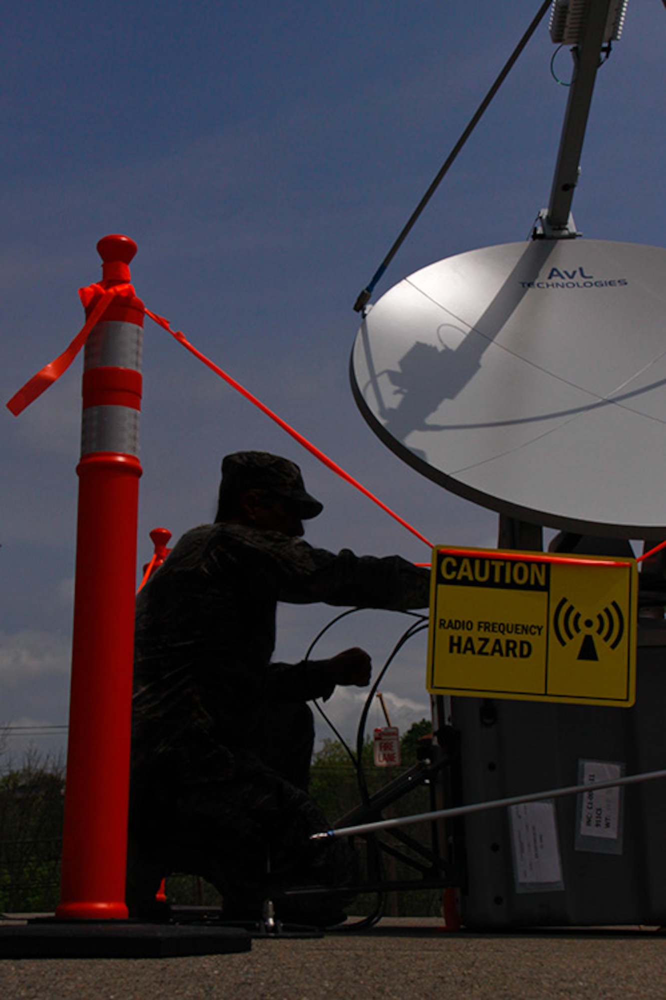 Tech. Sgt. David Defrank, a cyber-systems craftsman, attached to the 911th Airlift Wing Communications Squadron, works on the Joint Incident Site Communications Capability satellite dish (J.I.S.C.C.) outside of building 218, May 5, 2012. This system will be used by the 911th Communications Squadron during "Global Medic", a training exercise held at Fort Hunter-Ligget, CA, held in June 2012. (U.S. Air Force photo by Airman 1st Class Justyne Obeldobel/Released)