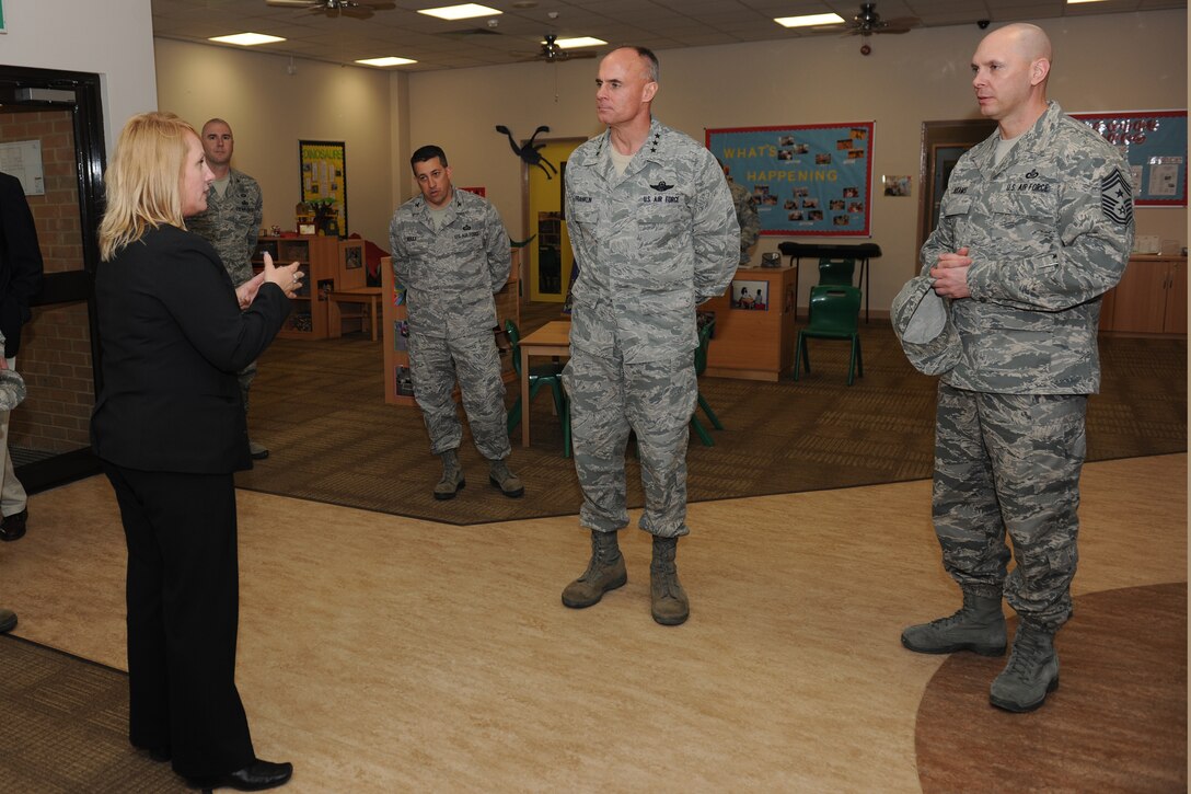 RAF ALCONBURY, England - Christine Kaleikini, 423rd Force Support Squadron Airman and Family Services Flight chief, shows Lt. Gen. Craig Franklin, 3rd Air Force commander, and Chief Master Sgt. Craig Adams, 3rd AF command chief, the RAF Alconbury Youth Programs facilities May 9. (U.S. Air Force photo by Senior Airman Joel Mease)