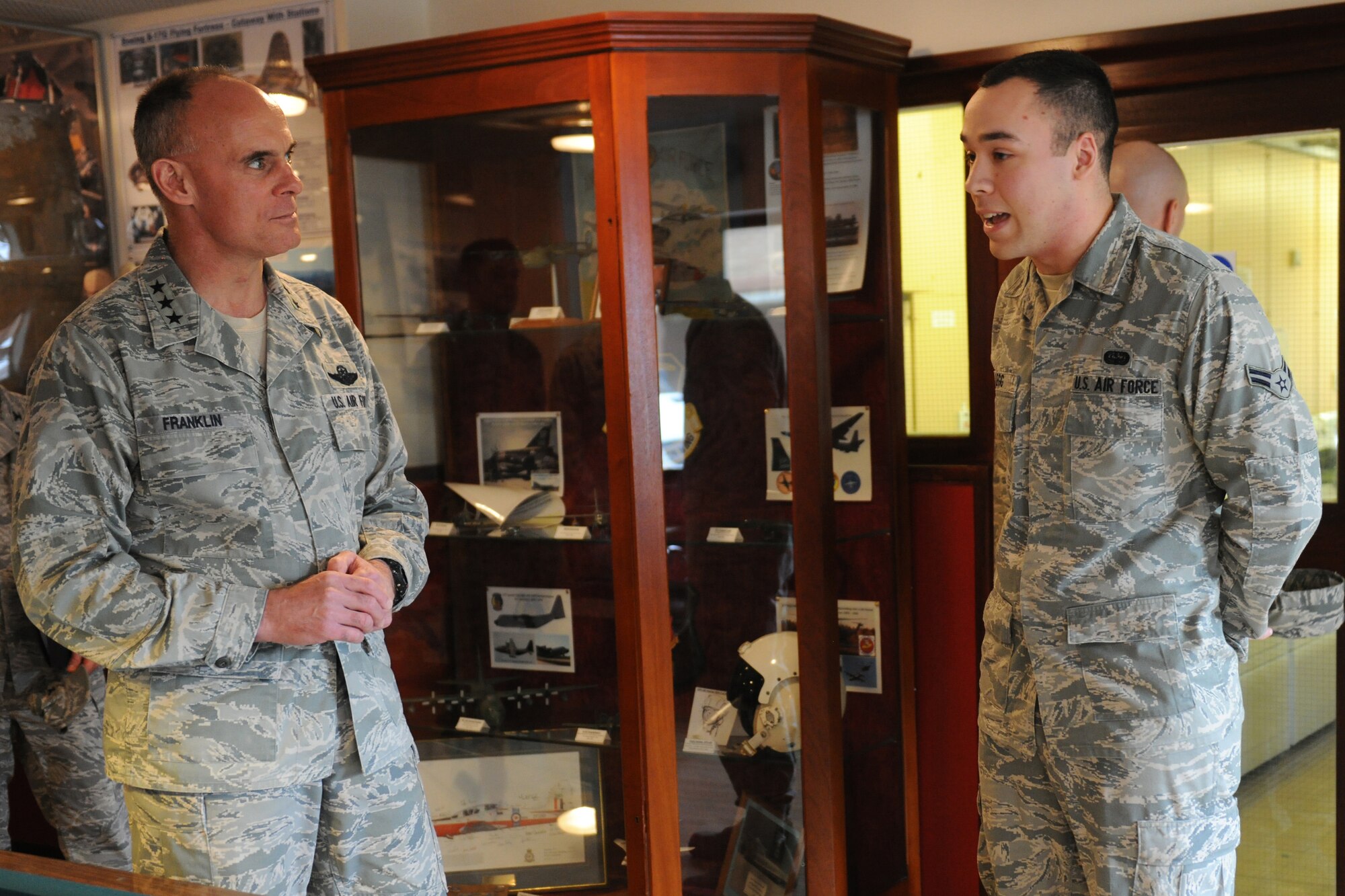 RAF ALCONBURY, England - Airman 1st Class Daniel Legg, 423rd Communications Squadron, shows Lt. Gen. Craig Franklin, 3rd Air Force commander, the day room at the RAF Alconbury Dormitory May 9. Legg told the general how important the day room was to unaccompanied junior enlisted personnel living in the dormitory. (U.S. Air Force photo by Senior Airman Joel Mease)