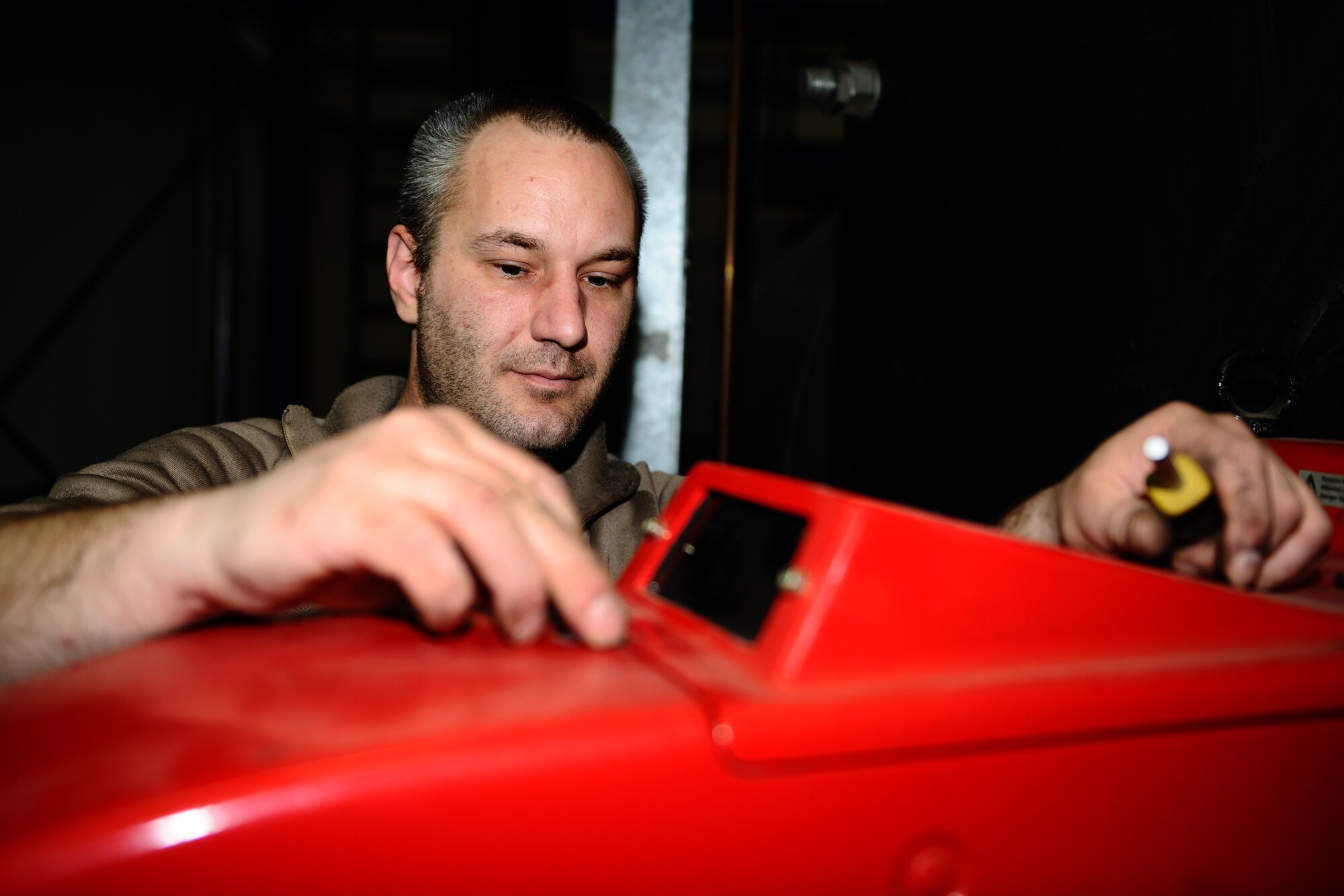 SPANGDAHLEM AIR BASE, Germany – Hubert Berger, 52nd Civil Engineer Squadron Operations Flight Heating, Ventilation and Air Conditioning Element boiler mechanic, reattaches the cover on an oil burner after performing biannual cleaning of a boiler in Bldg. 34 here May 9. HVAC maintains, repairs and installs heating, cooling and ventilation systems located on Bitburg Annex, Spangdahlem AB and all of its geographically separated units. (U.S. Air Force photo by Airman 1st Class Matthew B. Fredericks/Released)