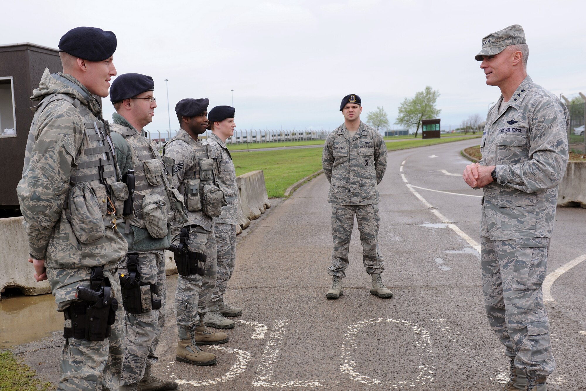 RAF ALCONBURY, England - Airmen assigned to the 423rd Security Forces Squadron brief Lt. Gen. Craig Franklin, 3rd Air Force commander, about the new large vehicle inspection site at RAF Alconbury May 9. The new gate provides a facility to inspect all incoming and outgoing commercial vehicle traffic, while significantly reducing congestion at the main gate. (U.S. Air Force photo by Senior Airman Joel Mease)