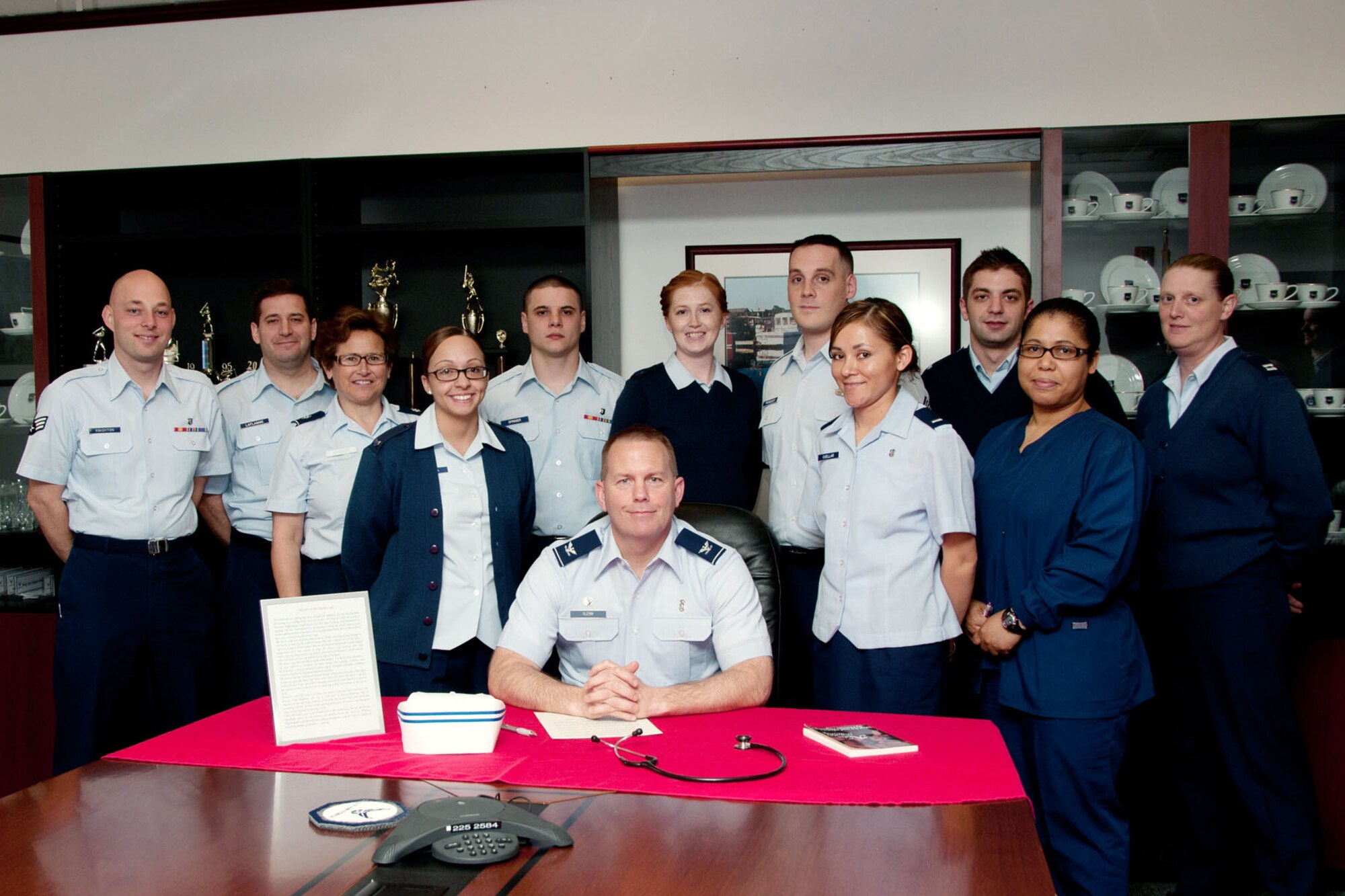 HANSCOM AIR FORCE BASE, Mass. - Col. Frank A. Glenn (front), 66th Medical Squadron commander, prepares to sign a proclamation declaring May 7 through 11 as Nurses and Technician Week in Building 1900 while squadron nurses and technicians stand by. Throughout the week, nurses and technicians were honored as part of the special recognition. (U.S. Air Force photo by Linda LaBonte Britt)