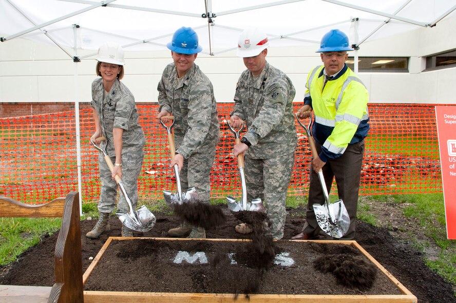 HANSCOM AIR FORCE BASE, Mass. -- (left to right) Col. Stacy L. Yike, 66th Air Base Group commander; Col. Frank A. Glenn, 66th Medical Squadron commander; Maj. Stephen Lavalle, U.S. Army Corps of Engineers project engineer; and Joe Spangenberger, Watermark Environment Inc. vice president, break ground on a new Mental Health Clinic addition to Building 1900 on May 1. Completion of the project is scheduled for January 2013. (U.S. Air Force photo by Mark Wyatt)