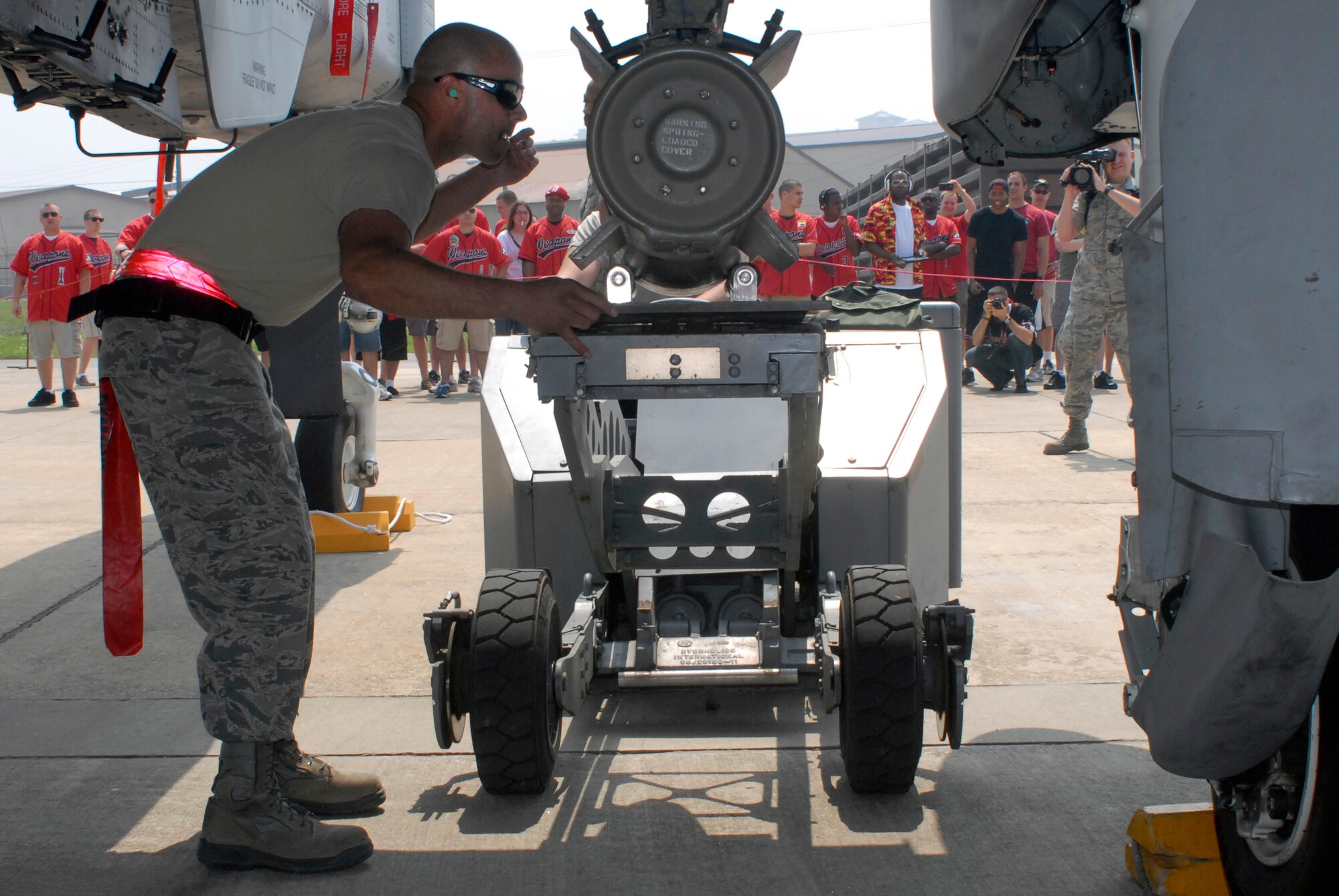 Tech. Sgt. Javier Figueroa-Chevere, 75th Aircraft Maintenance Unit weapons loader, loads a Mk-82 500-pound bomb on an A-10 during a weapon loading competition at Osan Air Base, Republic of Korea, May 5, 2012. (U.S. Air Force photo/Tech. Sgt. Eric Petosky)