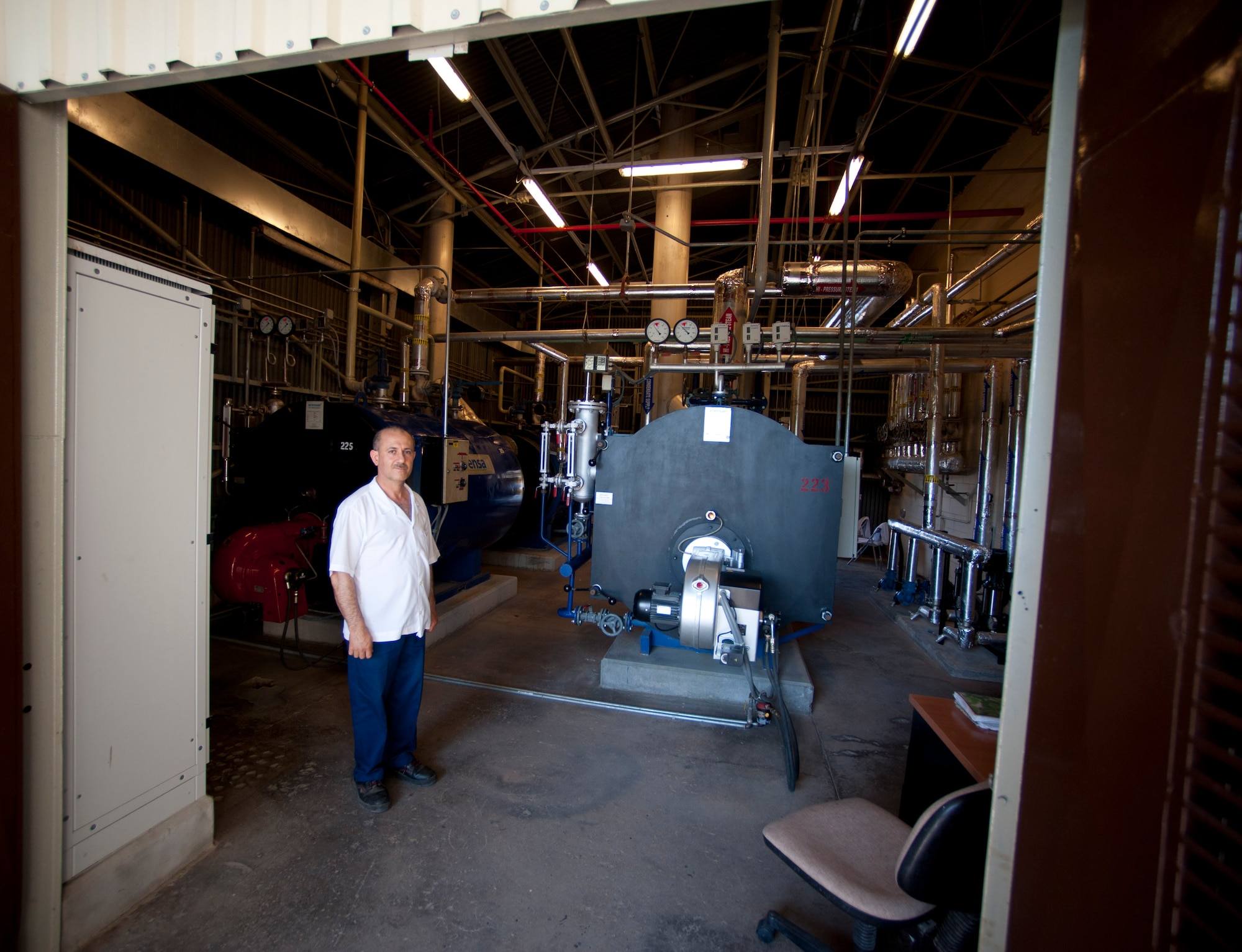 A member of the 39th Force Support Squadron showcases machines used at the fabric care facility May 9, 2012, at Incirlik Air Base, Turkey. The facility, which attends to approximately 60,000 articles a month, is one of only two Air Force owned and operated fabric facilities in the Air Force. The other facility is located at Kadena Air Base, Japan. (U.S. Air Force photo by Senior Airman William O'Brien/Released)
